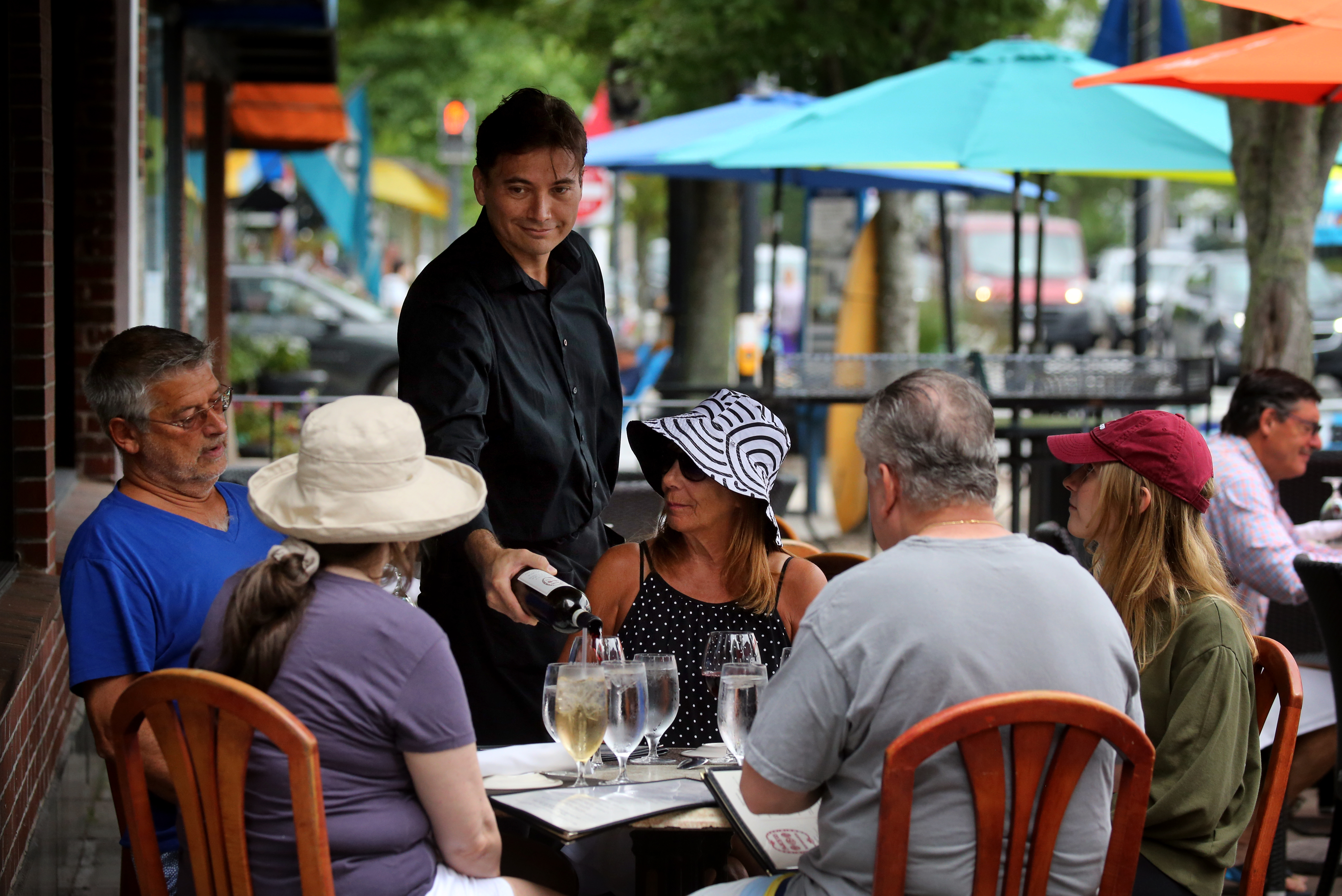Luis Harnes poured wine for guests at Alberto’s Restorante in Hyannis.