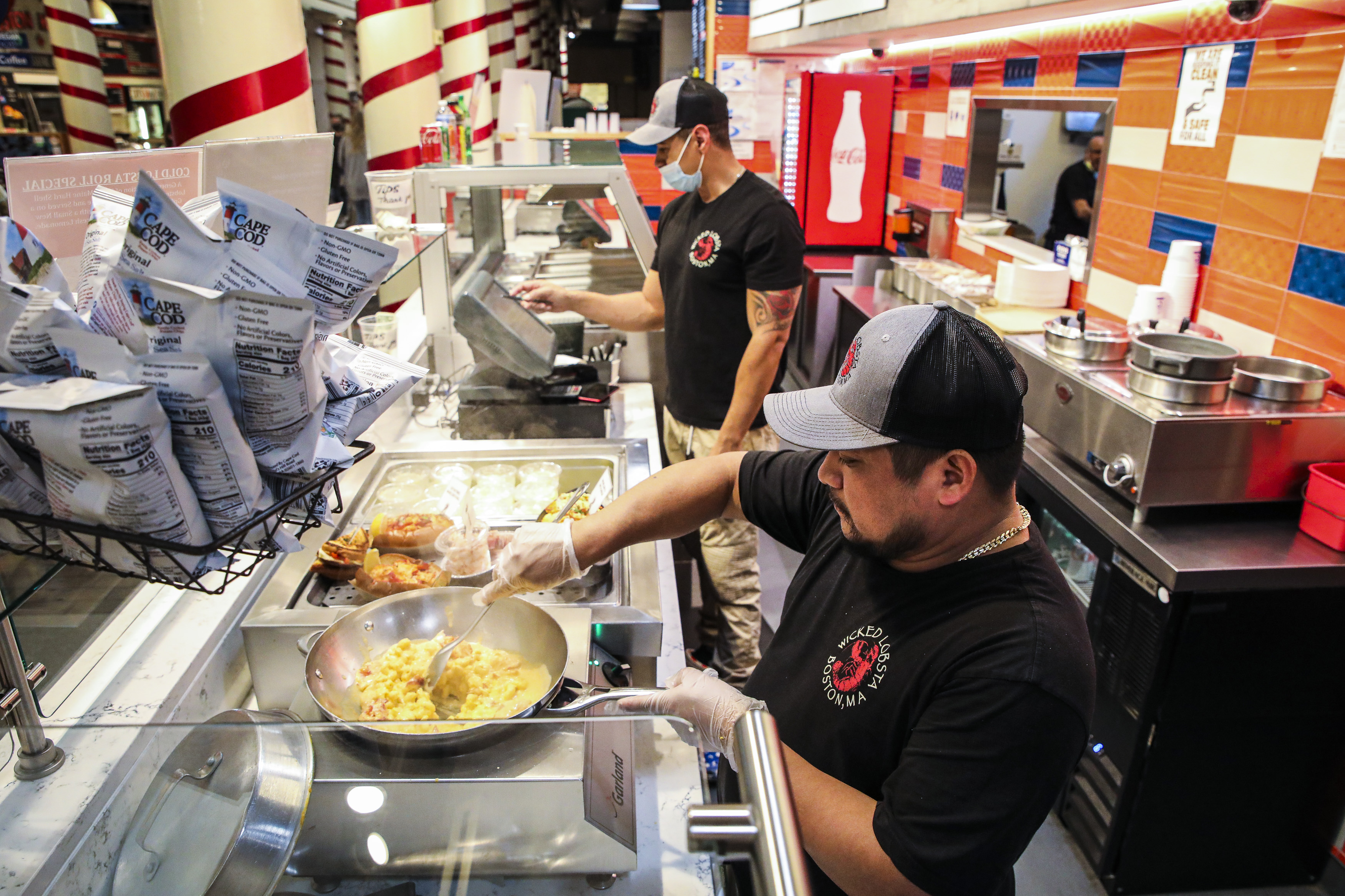 Adolfo Garcia, an employee at Wicked Lobsta in Quincy Market at Faneuil Hall Marketplace, cooked up lobster mac & cheese on Thursday.