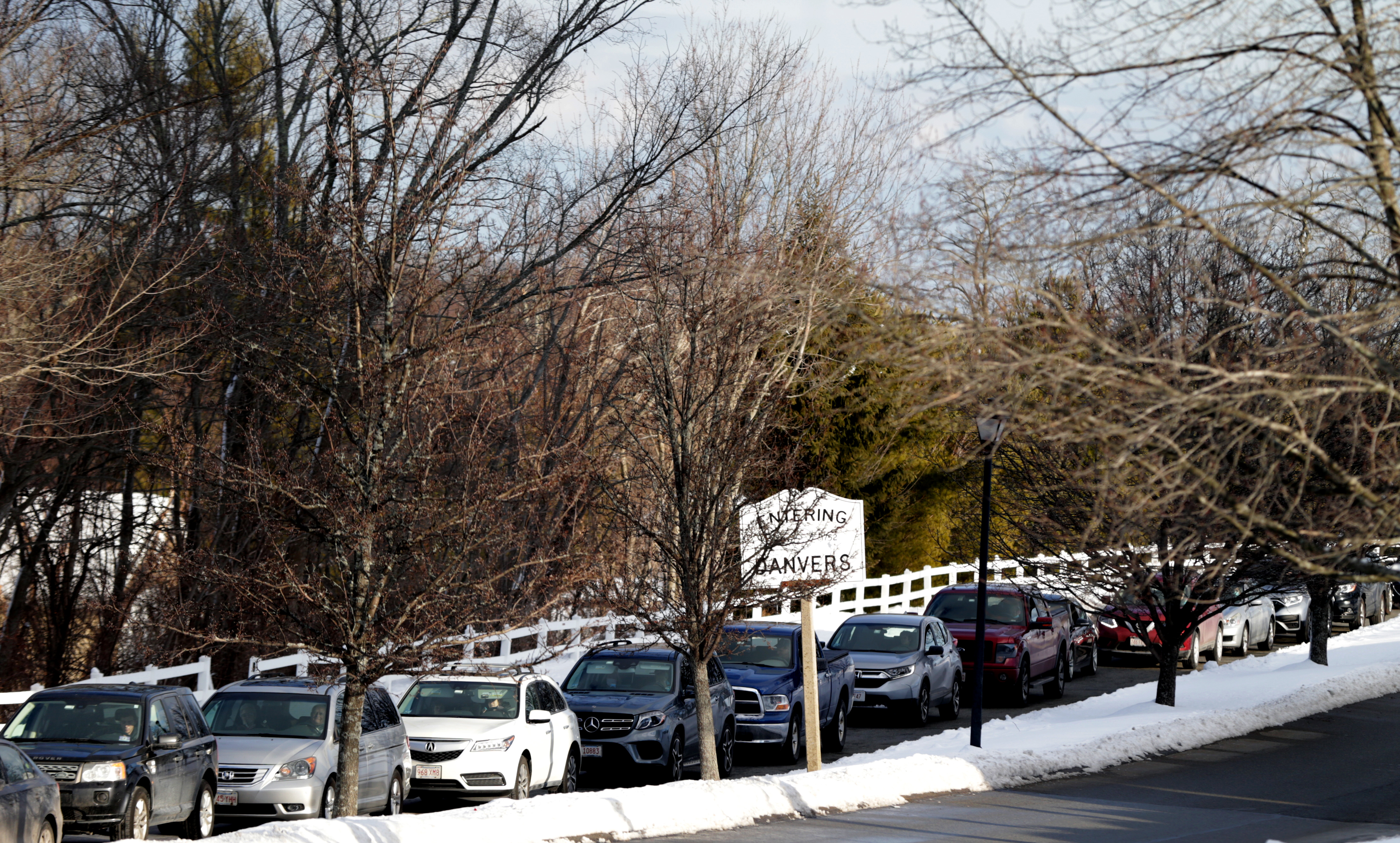 Cars lined up outside the DoubleTree Hotel in Danvers on Wednesday.
