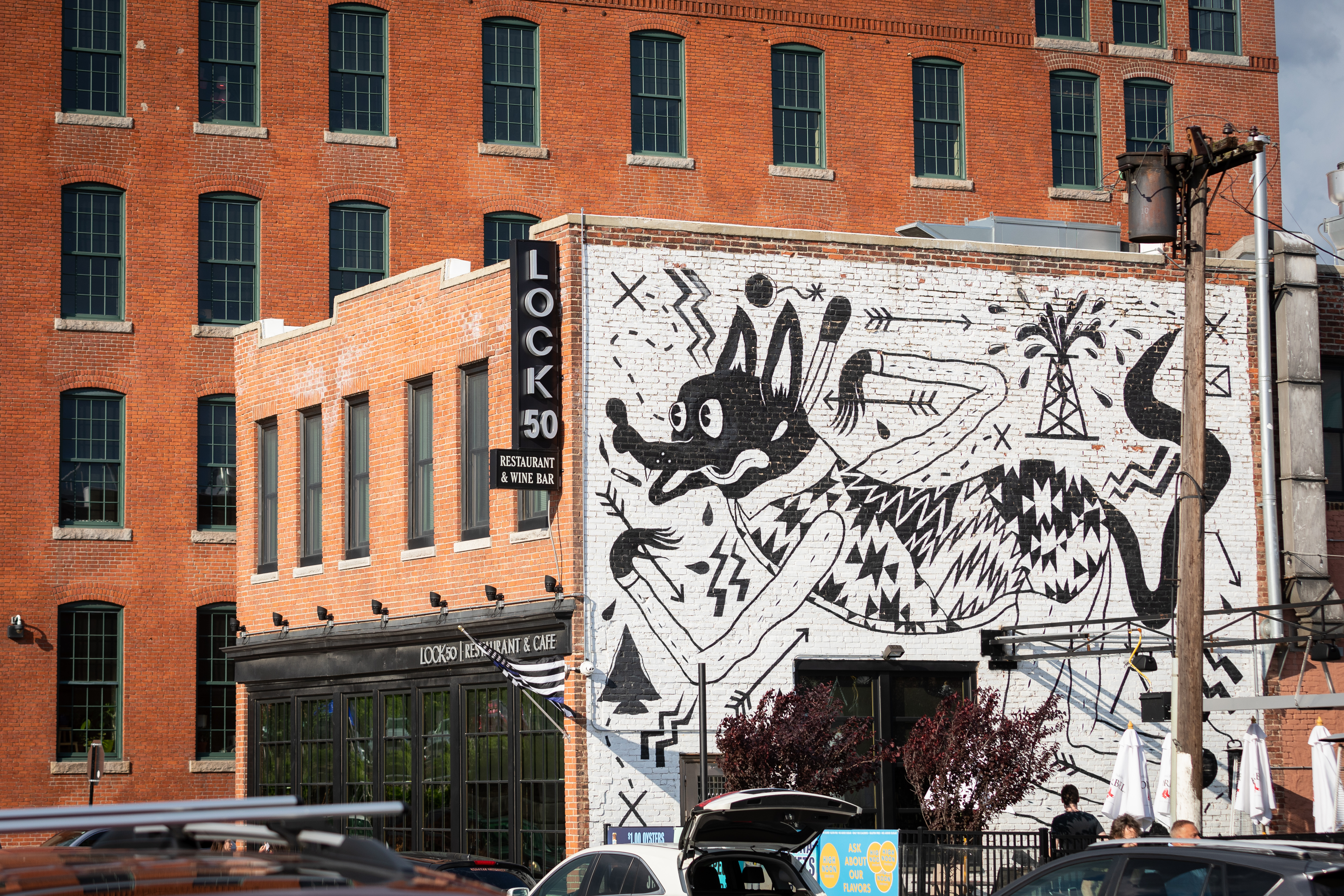 Lock 50 Restaurant & Wine Bar, an upscale business on Water Street, abuts a former mill that was converted into housing.