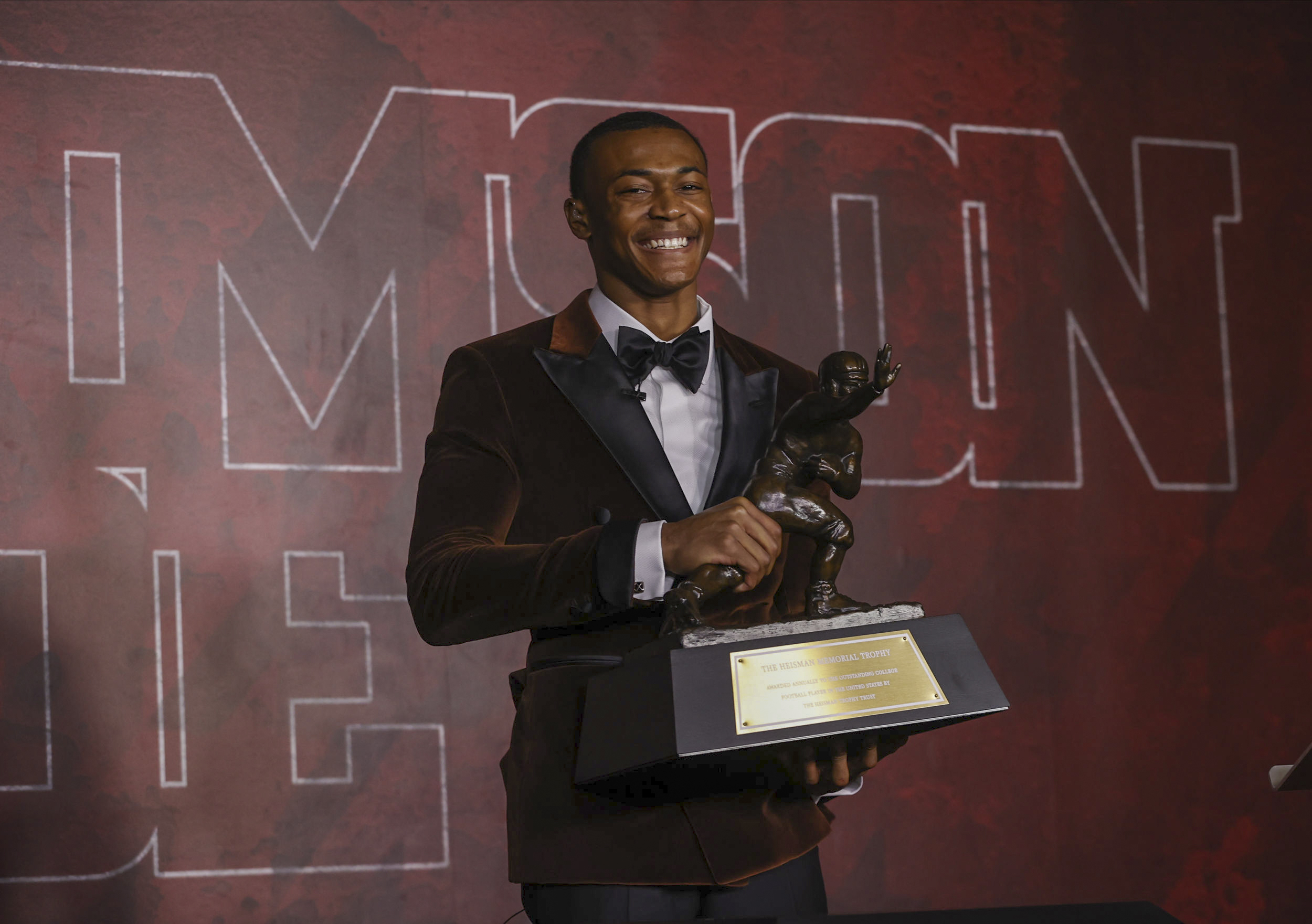 DeVonta Smith accepts the Heisman Trophy in January.