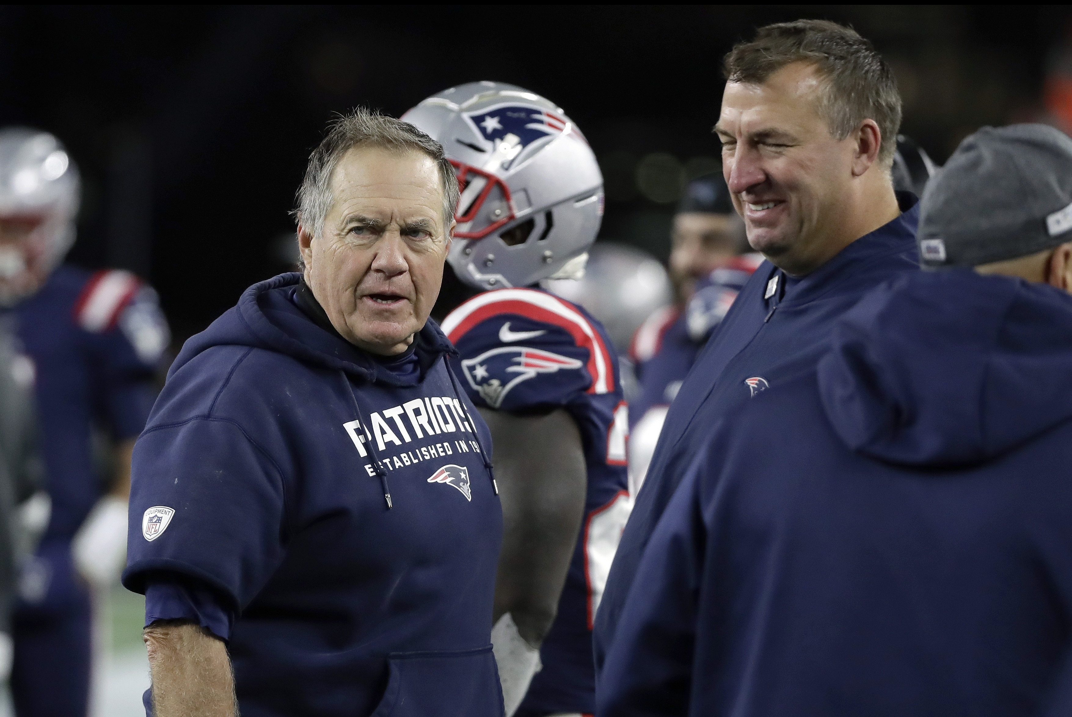 Bret Bielema (right) became the Patriots' defensive line coach in 2018, but his salary stayed below the threshold that would allow the Razorback Foundation to stop paying his buyout from Arkansas.