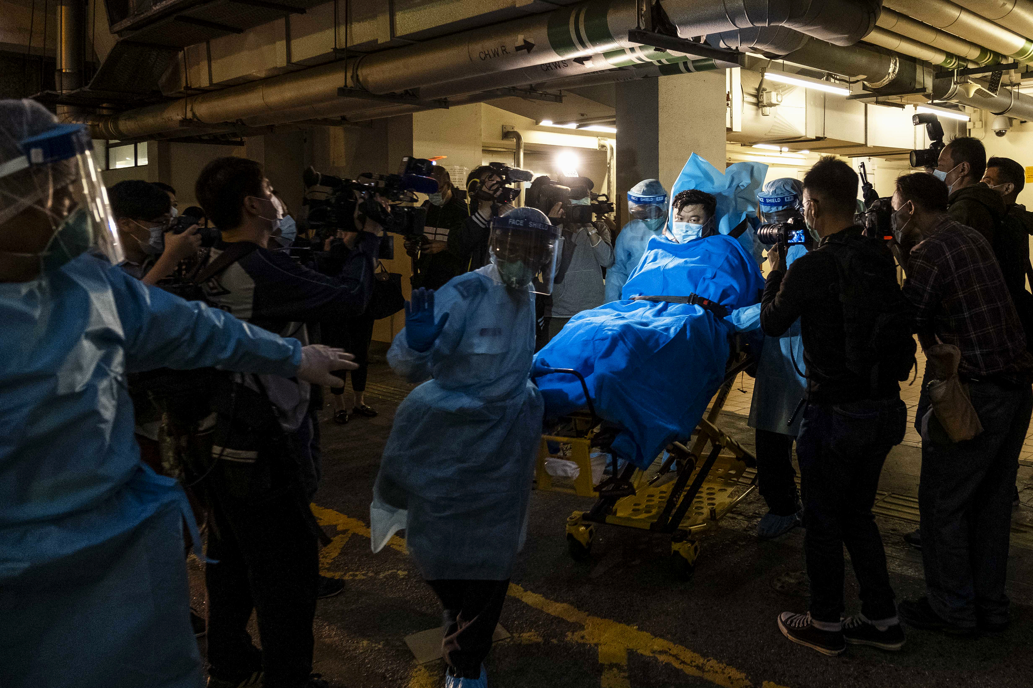 Paramedics transported a man believed to be Hong Kong's first coronavirus patient to a hospital.