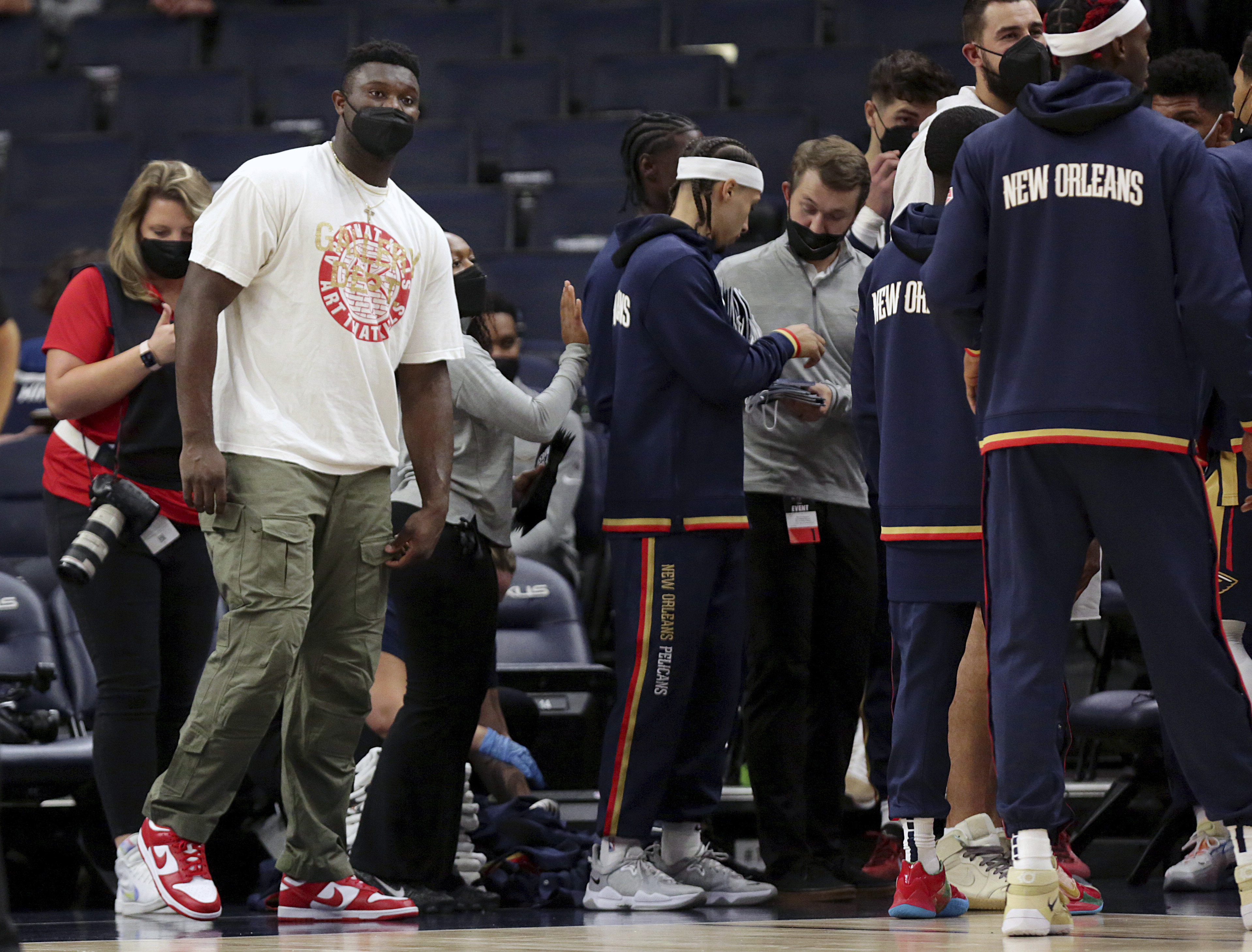 Zion Williamson (left) will be out for several weeks with a foot injury.