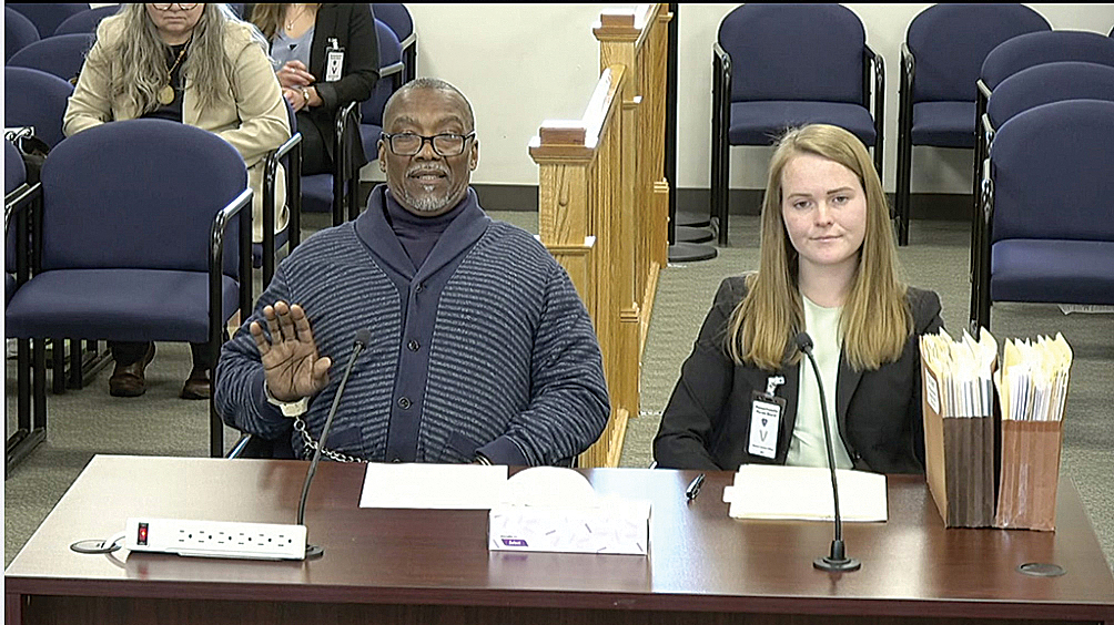 Kent Tyler (left), accompanied by a student attorney at a parole board hearing in January.