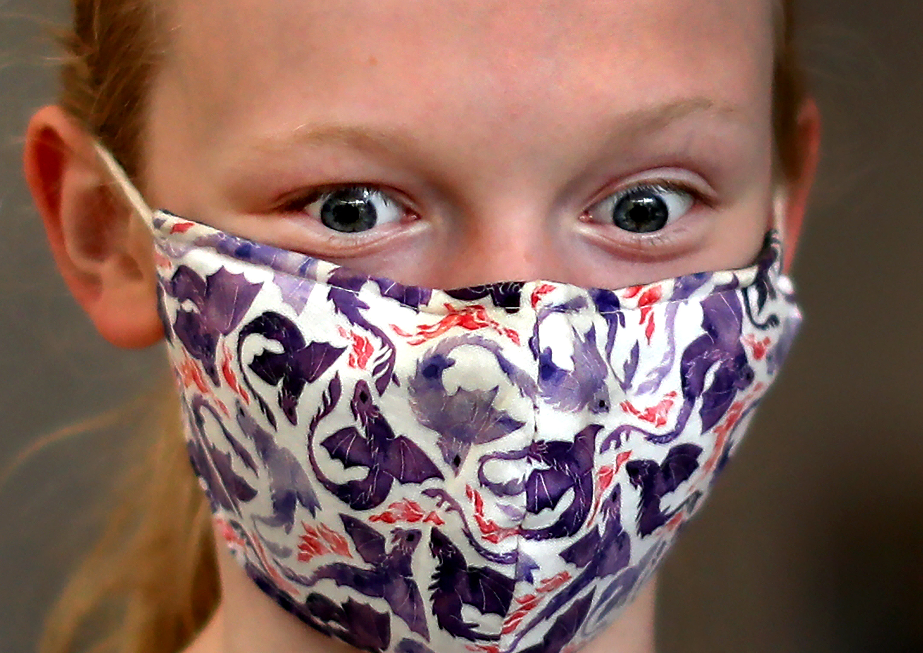 Caroline Dunne, 12, from Newton reacted after getting her Pfizer vaccination at Newton North High School.