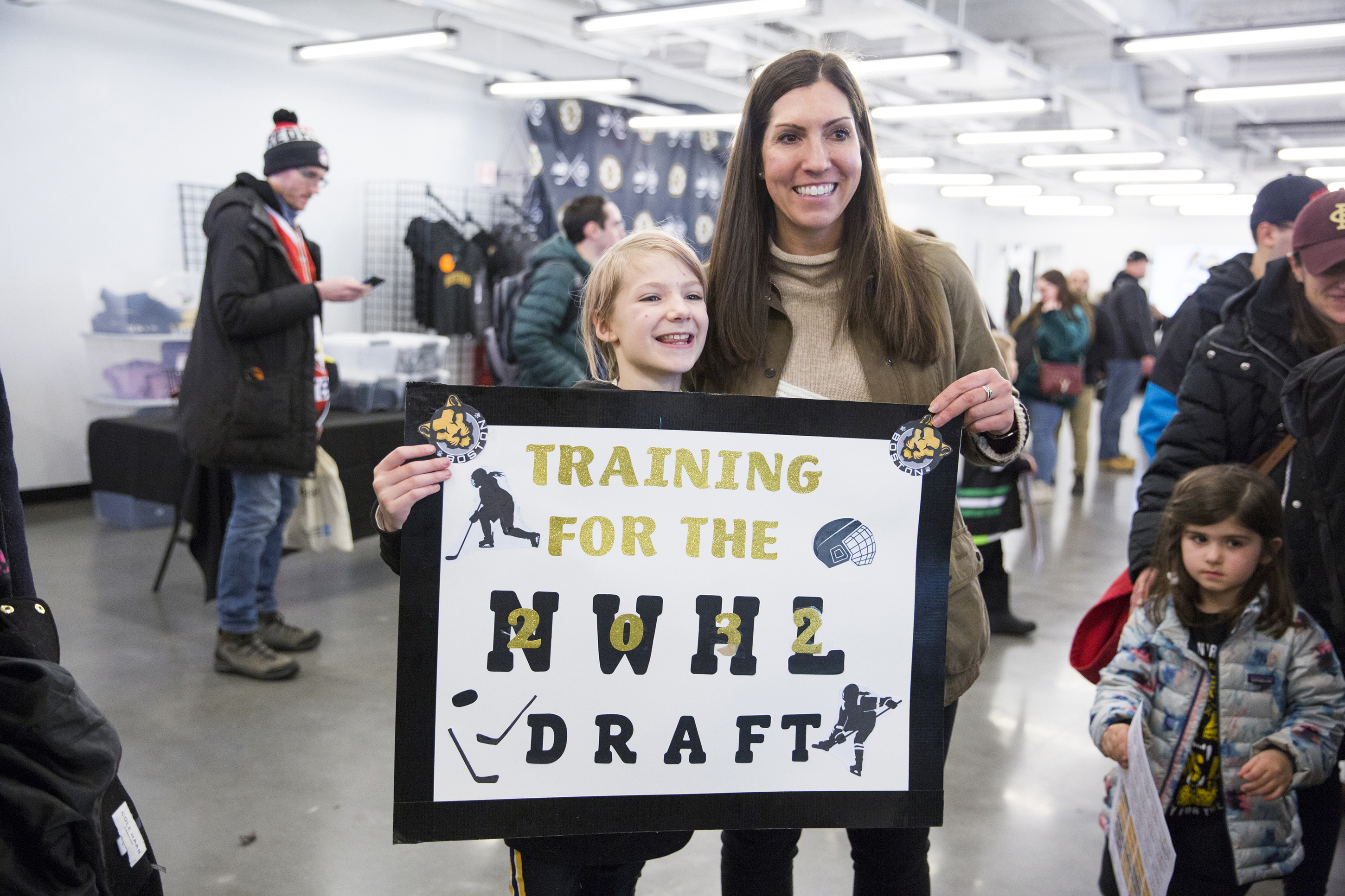 Hayley Moore meets with young fans during an event for the NWHL draft.