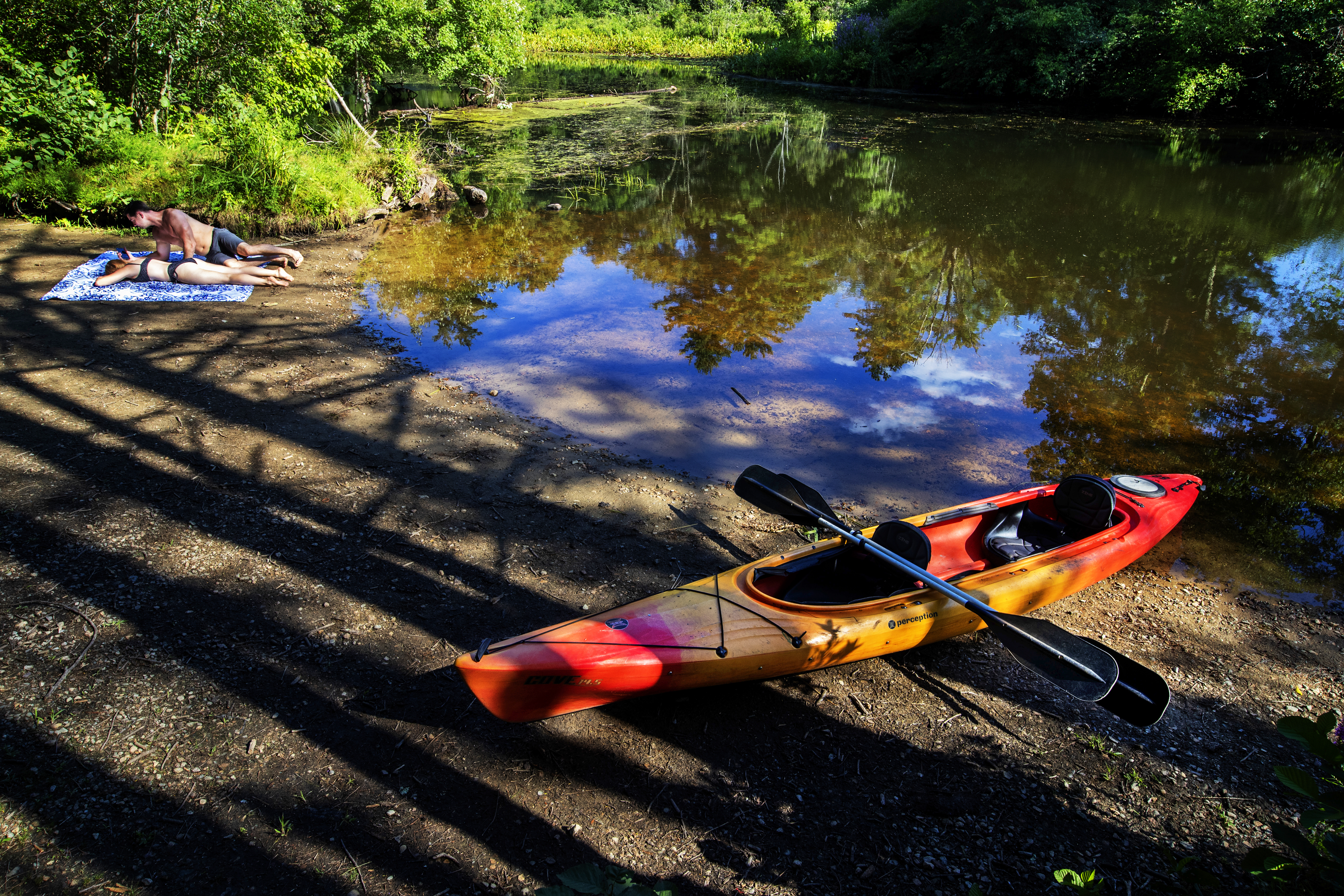 The Ipswich River is a popular place for sunbathing and canoeing.