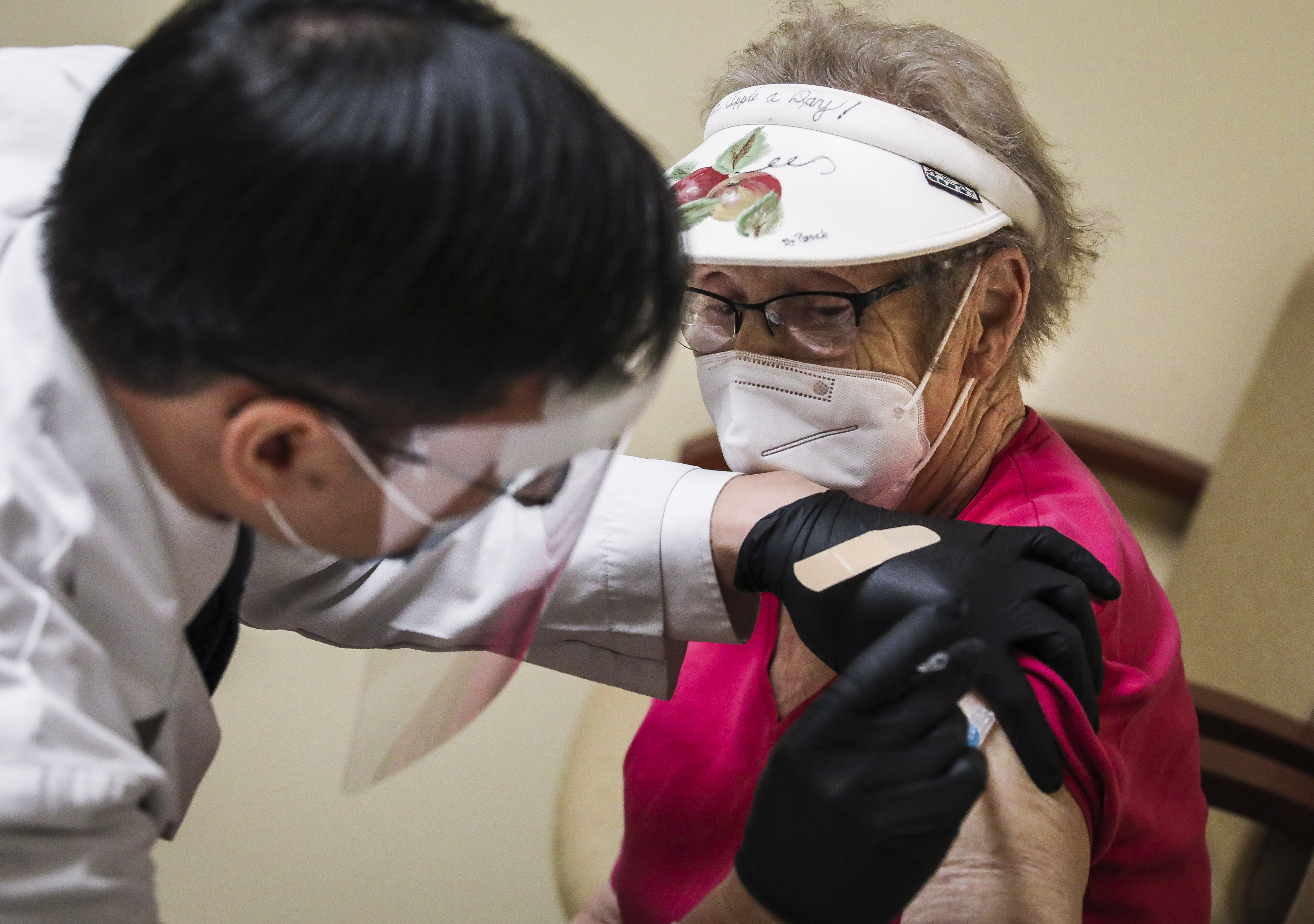 Pharmacy Manager Tuan Pham administered the COVID-19 vaccine to Pat Molan, 79, at the Taunton Hannaford Supermarket on Monday afternoon.