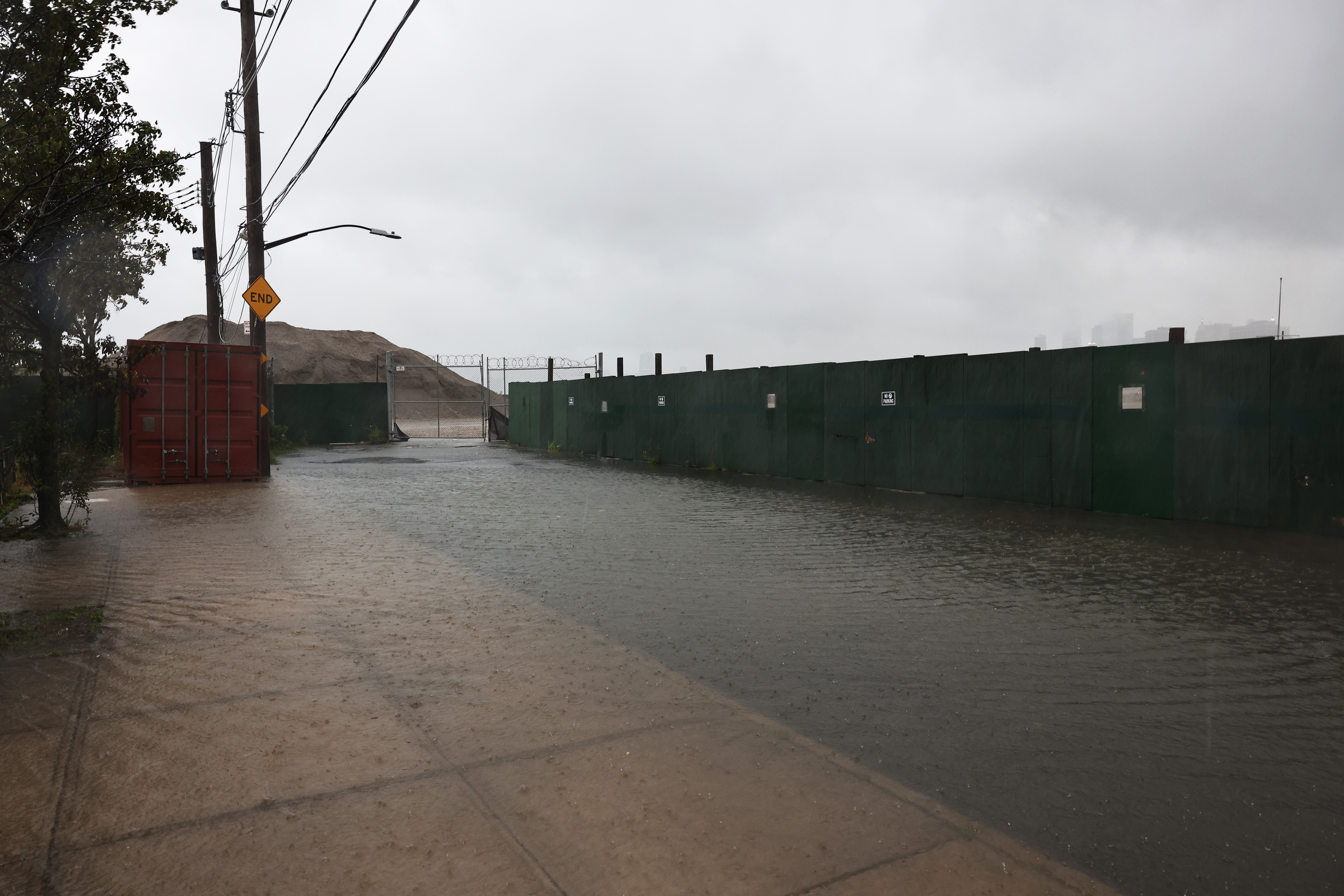 Water floods Dikeman Street in the Red Hook neighborhood of Brooklyn.