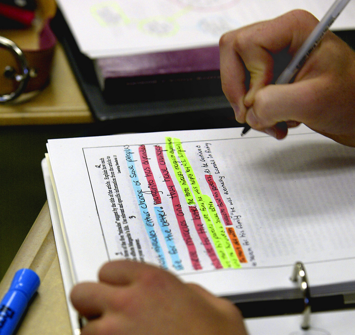 A student works on analyzing his English composition in preparation for the MCAS.