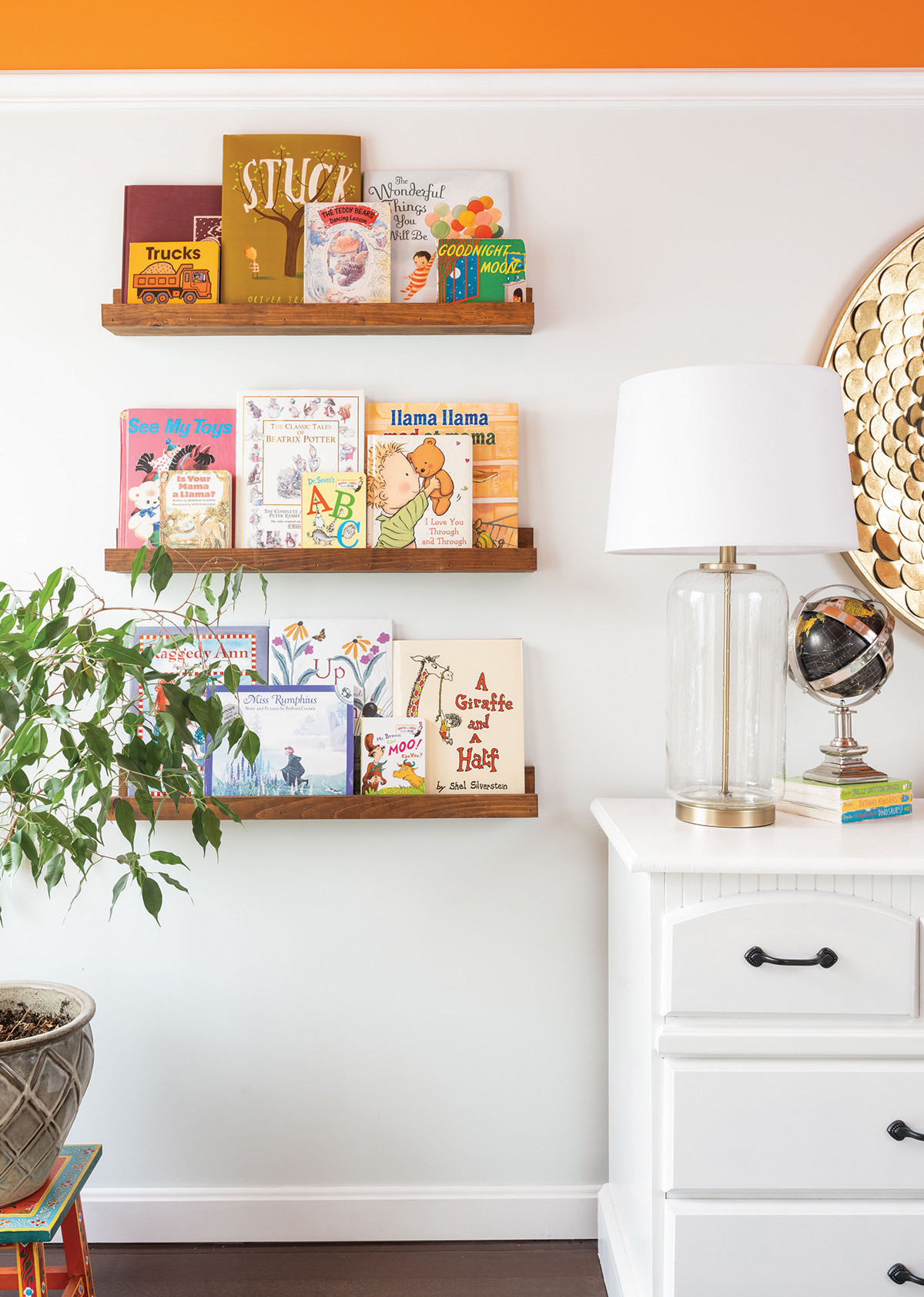 The homeowners used reclaimed lumber for the book ledges in Pierson’s nursery. “It’s the only homemade thing poor Pierson has in his room,” she laughs.