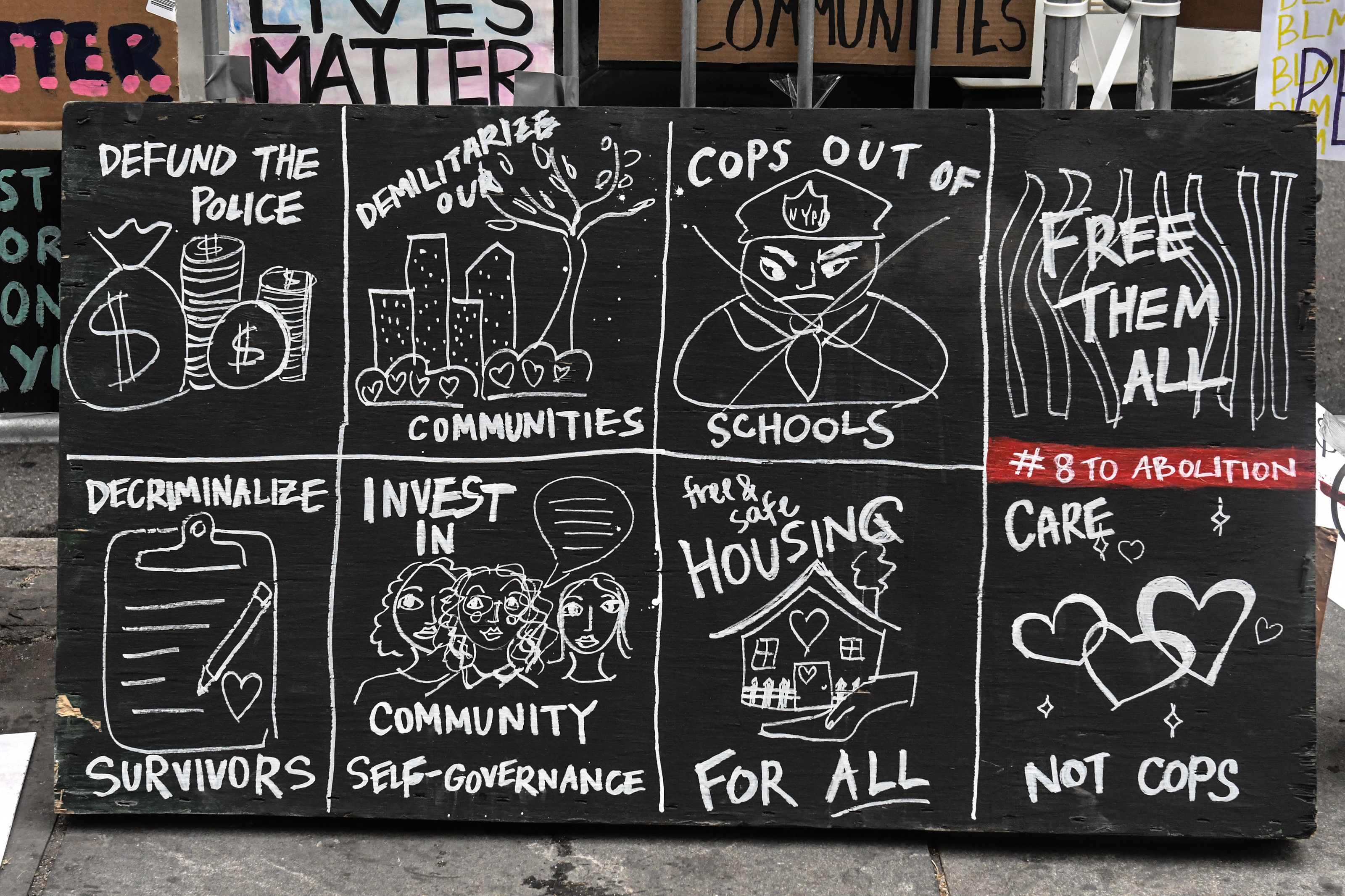 A sign outside a protest encampment where people advocated on July 25 for the New York City police department to have its funding reduced by $1 billion.