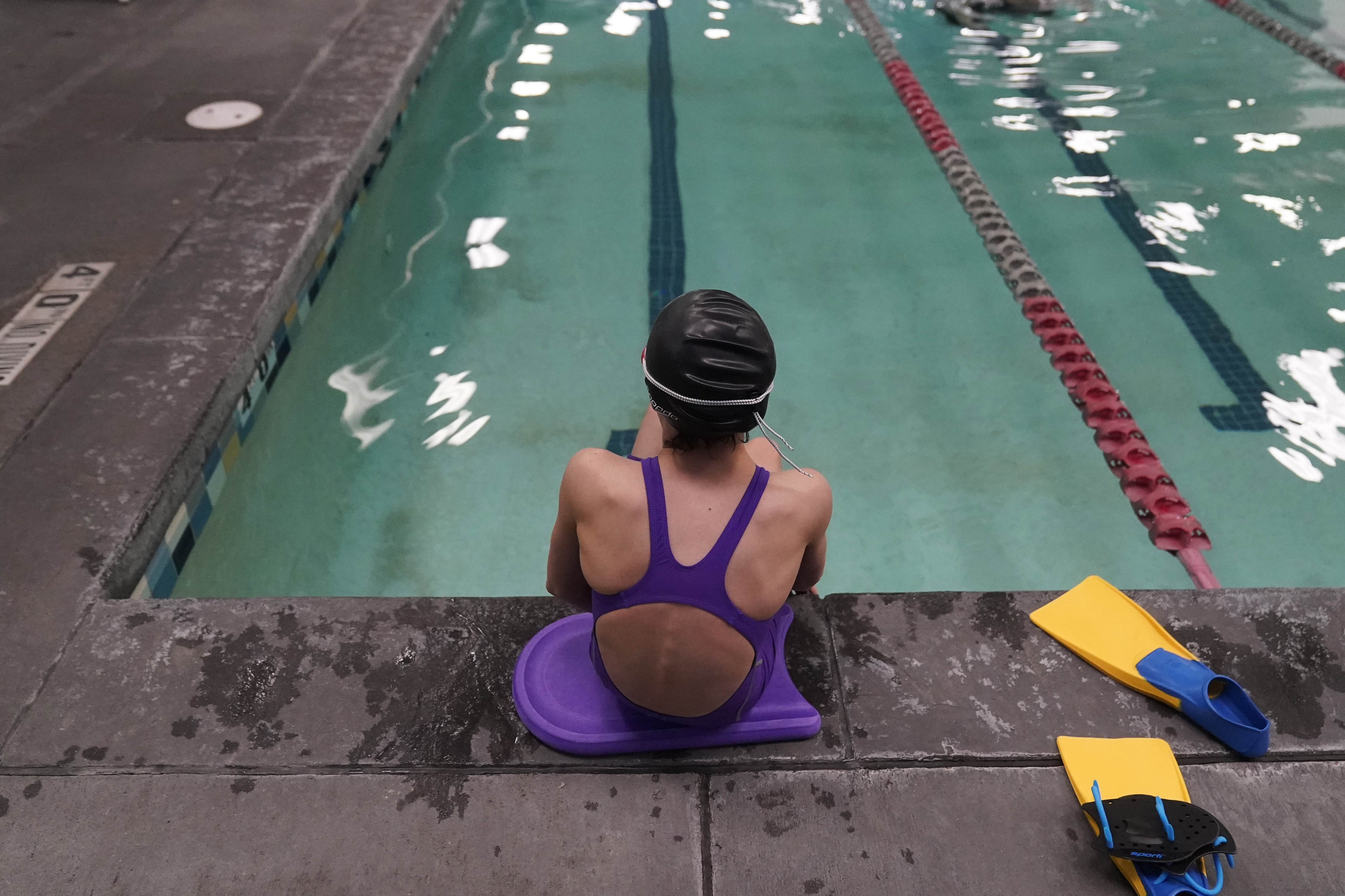 A proposed ban on transgender athletes playing female school sports in Utah would affect transgender girls like this 12-year-old swimmer, seen at a pool in the state on Feb. 22.