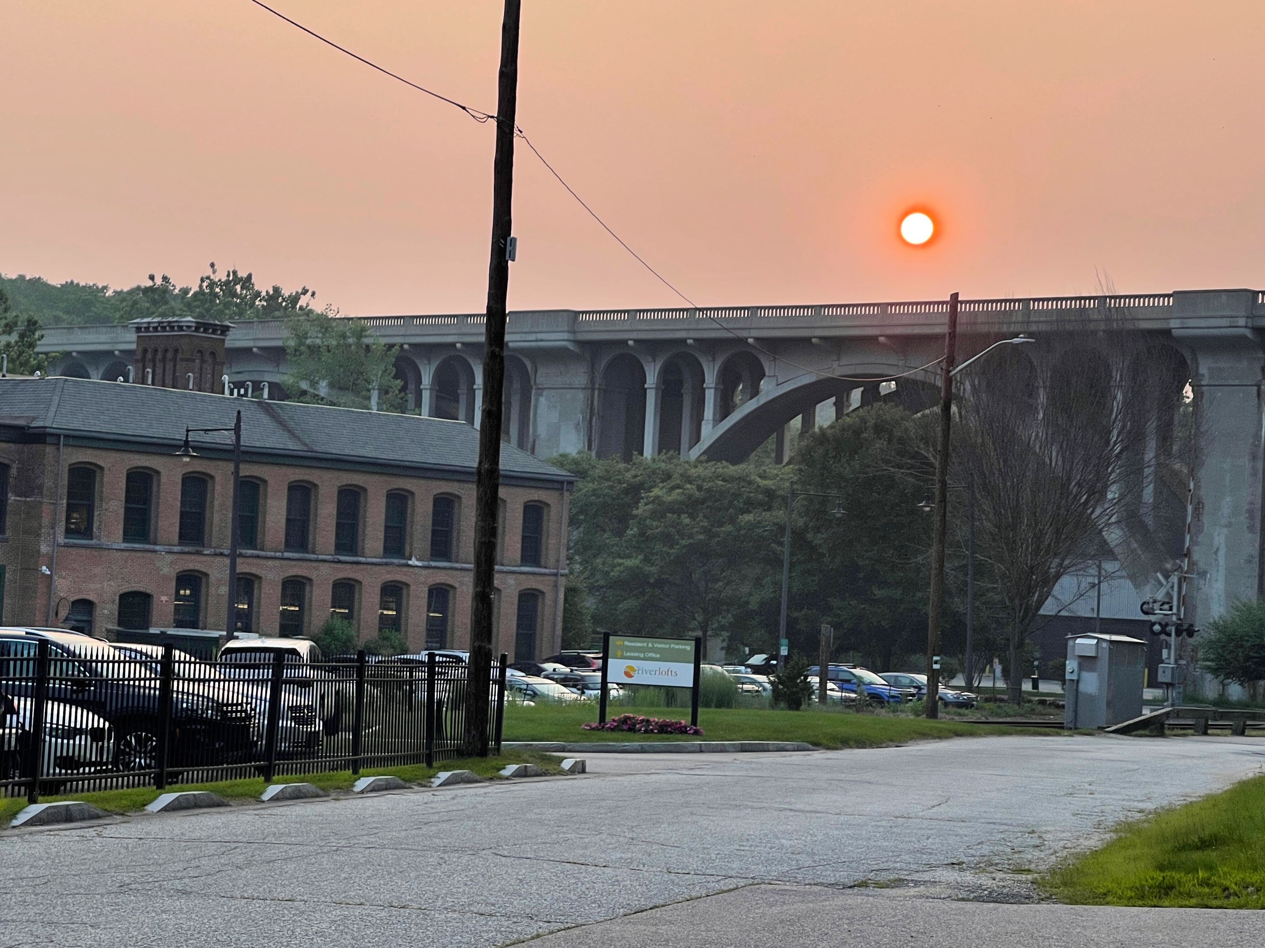 A hazy sunset in Cumberland, R.I., on July 26, 2021. Rhode Island is under its second air quality alert in a week due to Canadian wildfires.