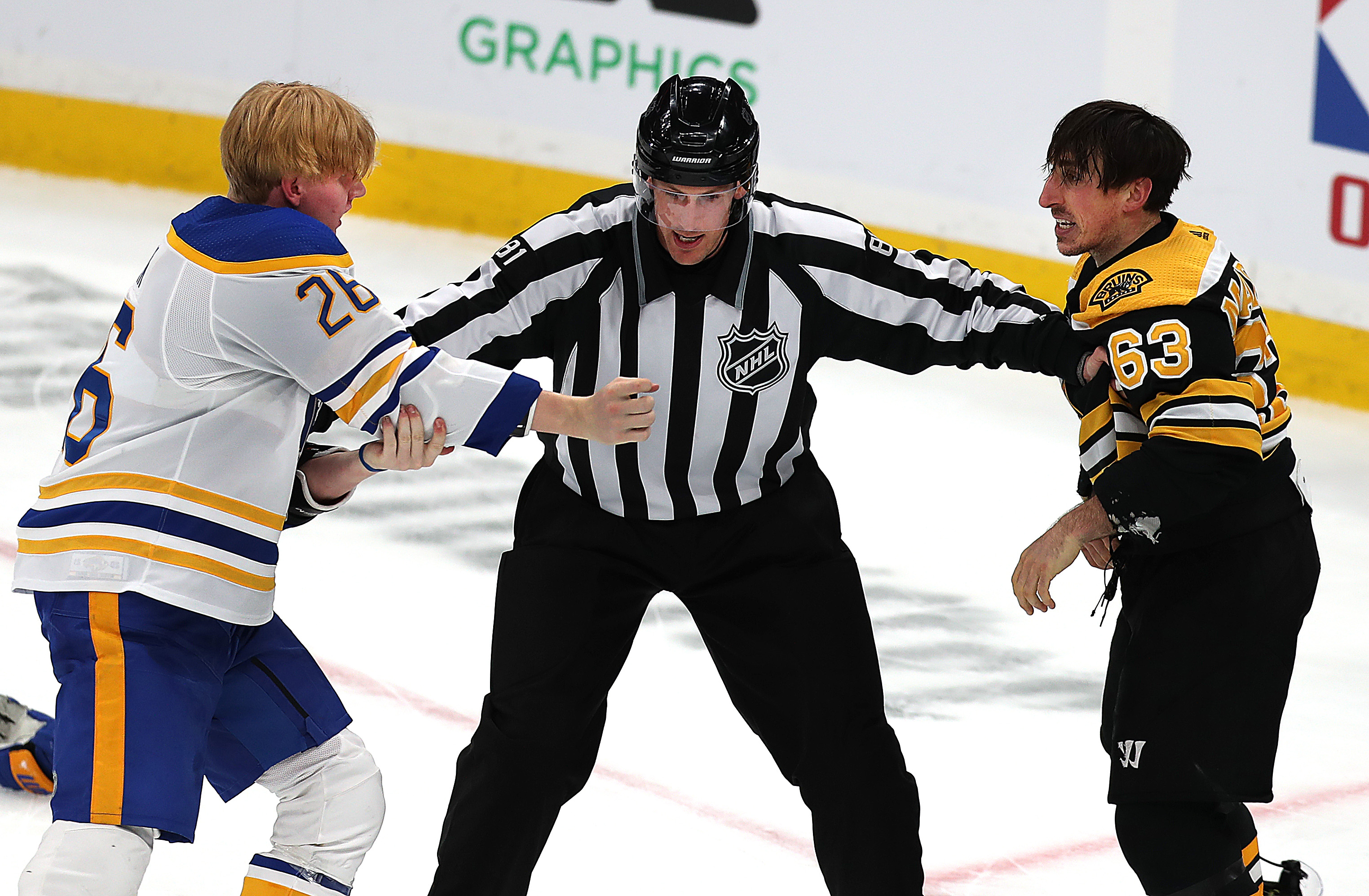Buffalo's Rasmus Dahlin and Brad Marchand were ready to go during the third period Saturday, but linesman Ryan Daisy of Mansfield wasn't so eager.