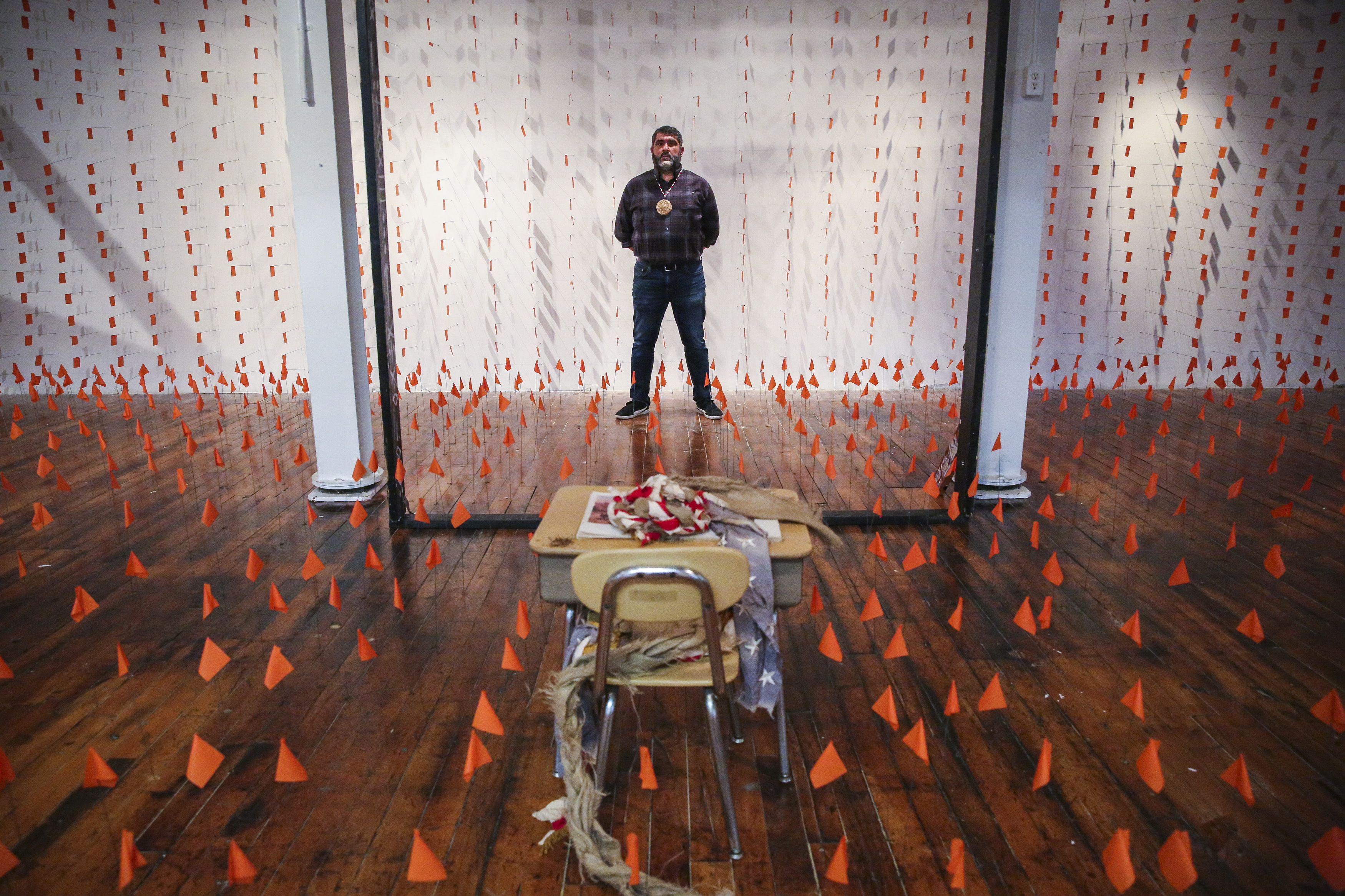 Artist Jason Montgomery's "Save the Man" installation, at the Eastworks building in Easthampton, where he says visitors have left notes about the canceled Northampton biennial. His installation is a memorial to Indigenous children who perished in Canada’s infamous residential schools.