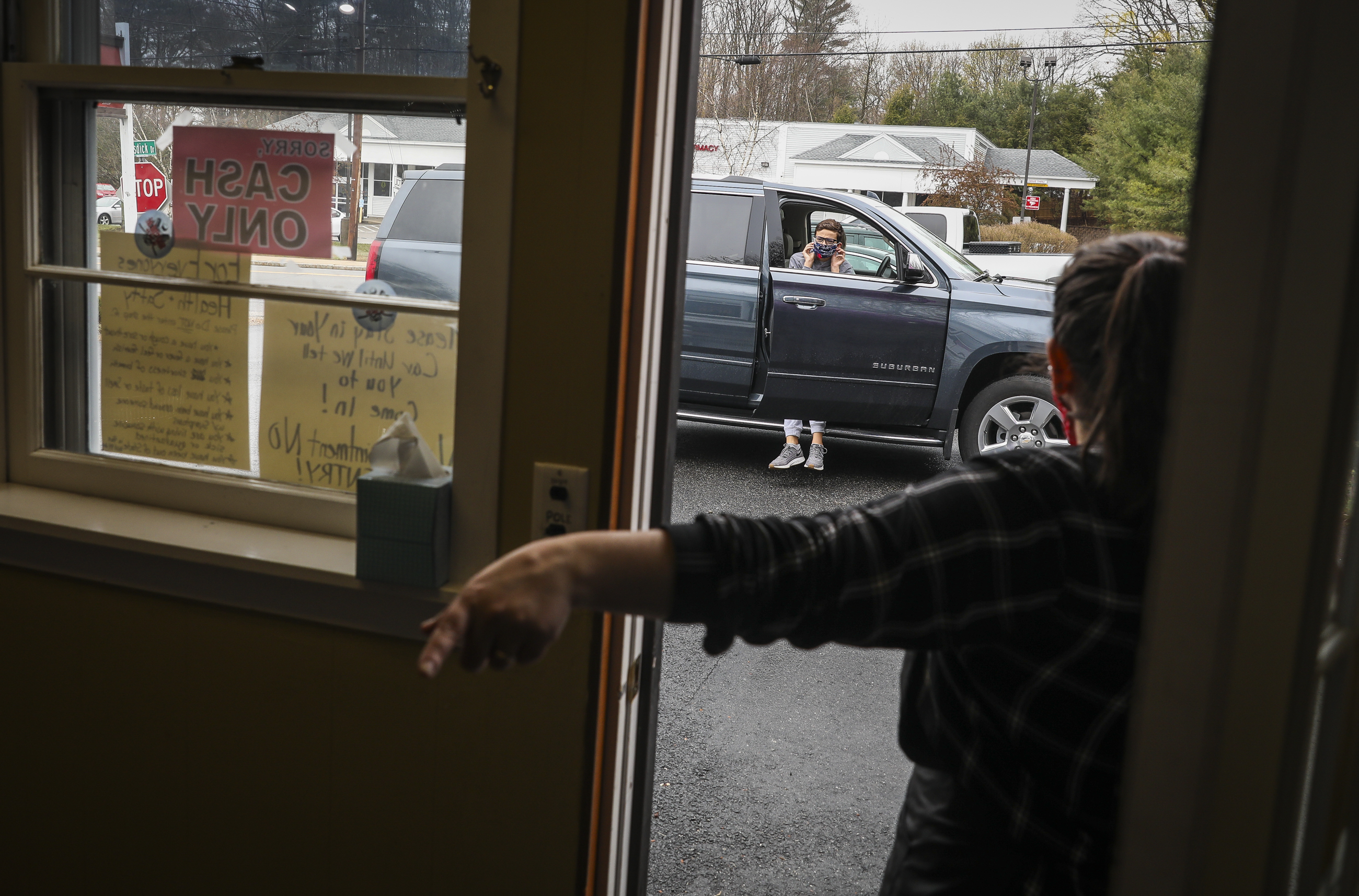 Brittany Horst of the Rusty Razor Barber Shop in Kittery, Maine, instructed Anthony Luchette to come in for his haircut on the first day of reopening.