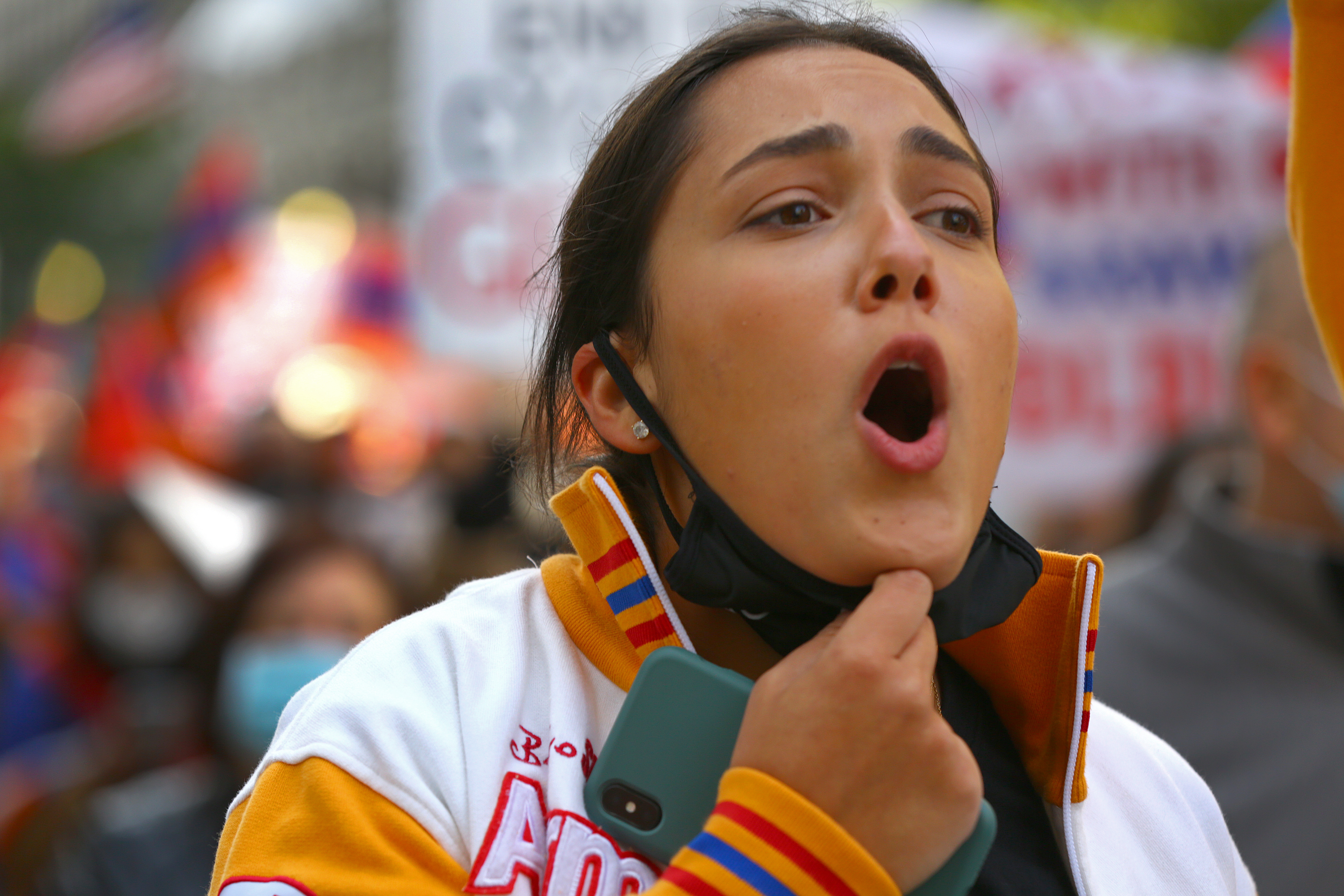 A woman chanted as Greater Boston Armenians marched from St. James Avenue, where they started their demonstration against Azeri aggression, during the continuing coronavirus pandemic.