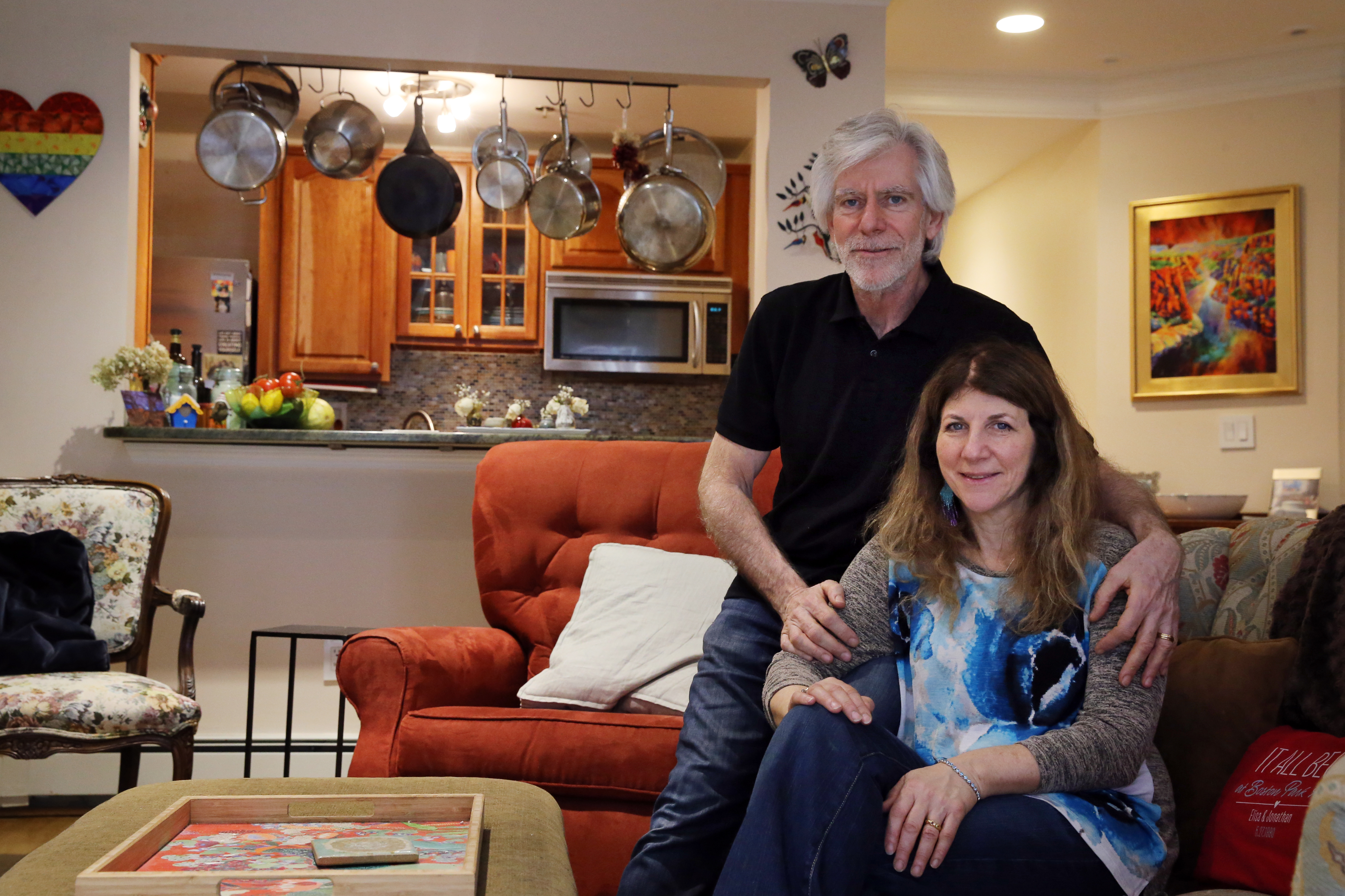 Boston, MA - 3/11/2021: Jonathan and Elisa Sweig pose for a portrait at their home in Boston, MA on March 11, 2021. The couple downsized during the pandemic from a 5-bedroom Colonial in Franklin. (Craig F. Walker/Globe Staff) coronavirus Covid-19 pandemic
