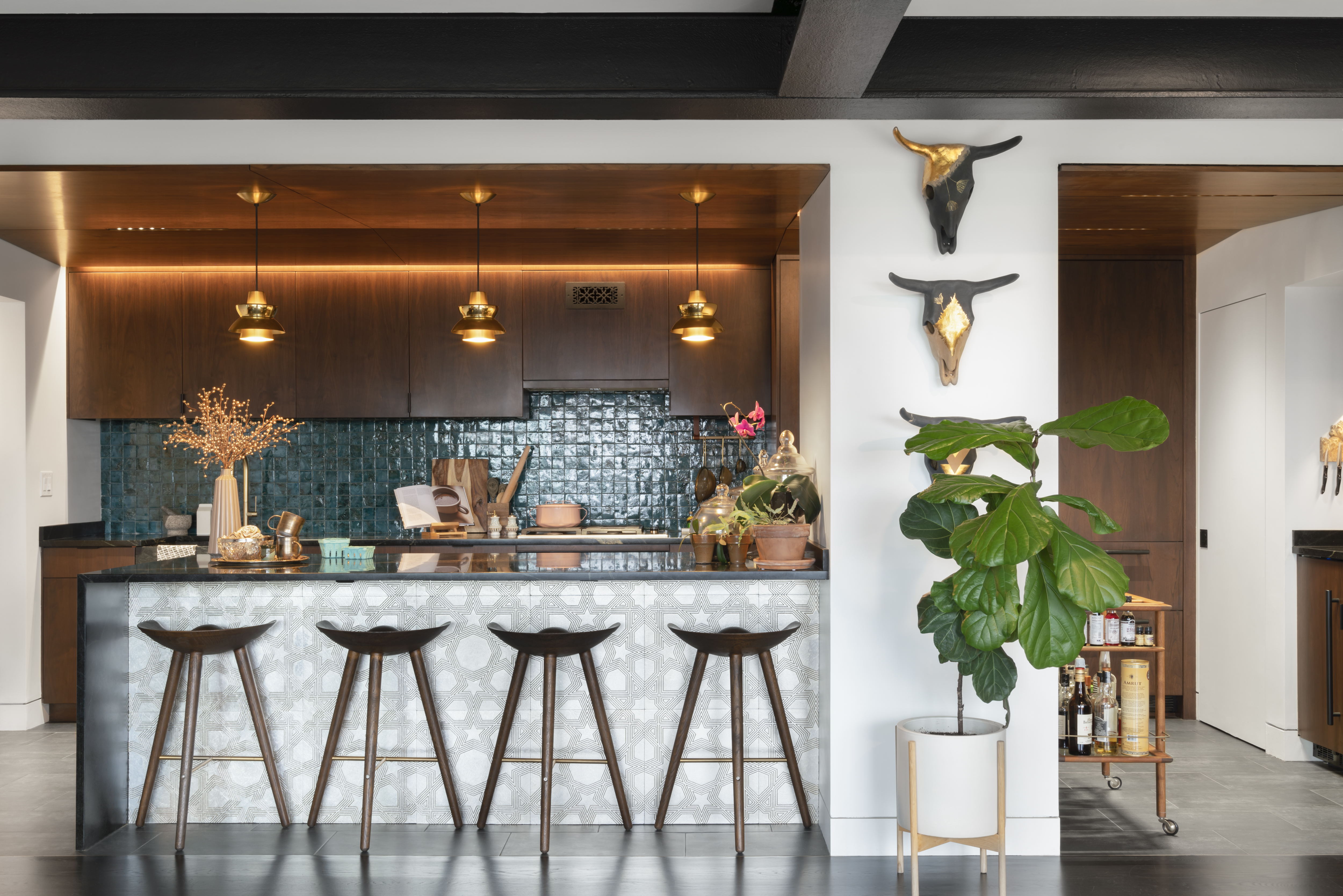 The new kitchen stretches across the wall and is open to the main living area.