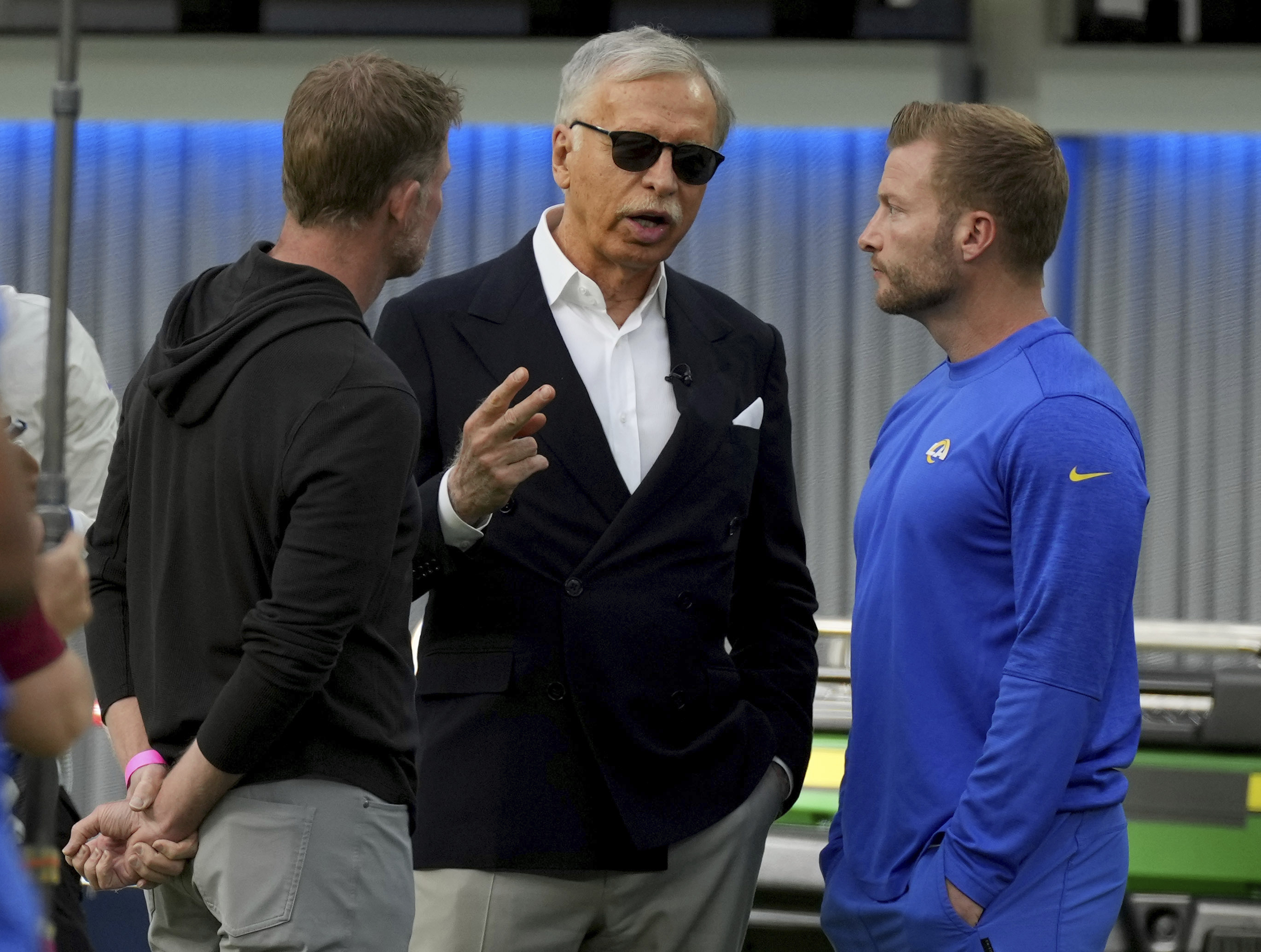 Los Angeles Rams owner Stan Kroenke (center) could be cutting a check to the City of St. Louis over his relocation of the franchise.