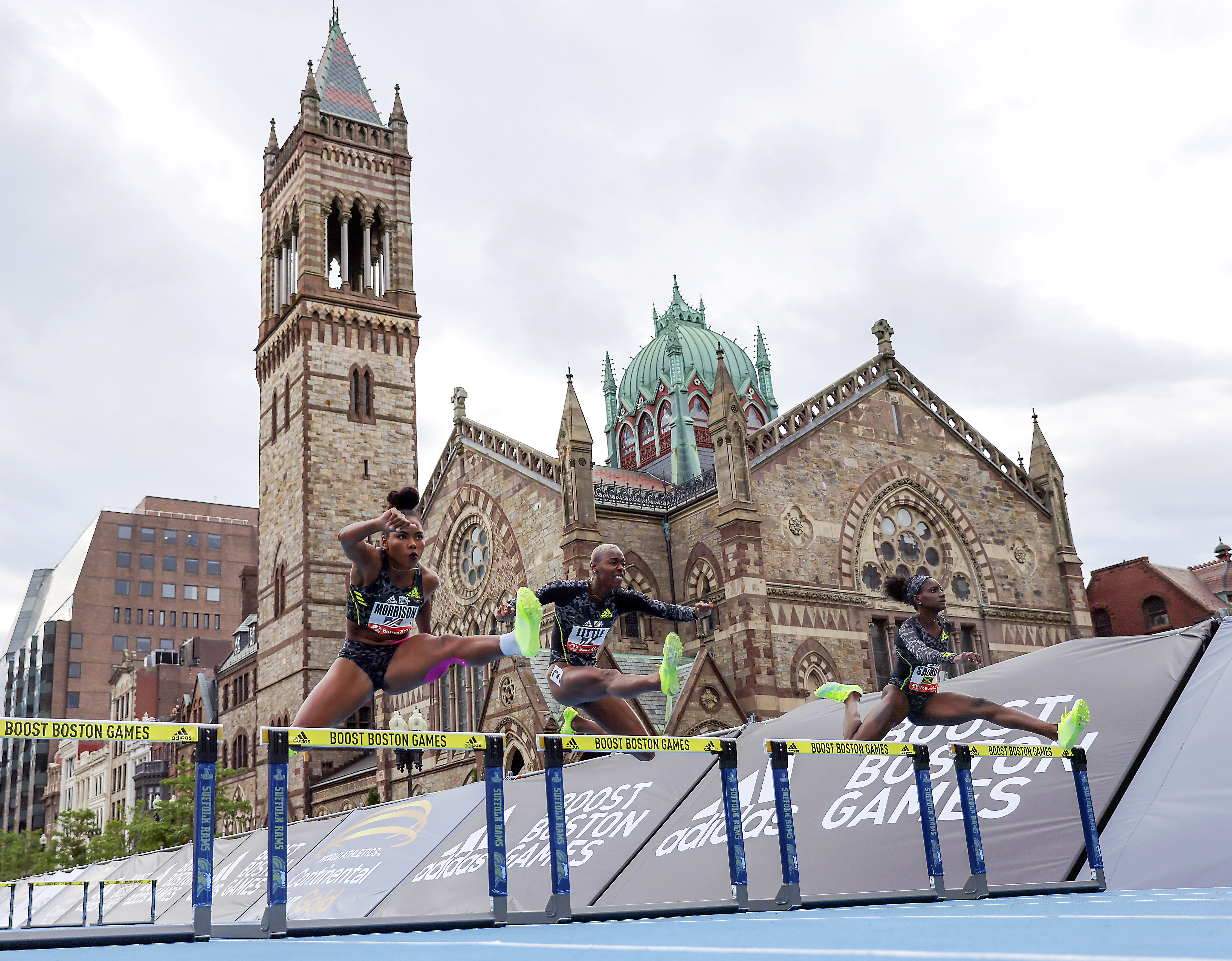 Ebony Morrison, left, Shamier Little, center, and Shiann Salmon participate in the womens 200M hurdles Sunday. Salmon won with a time of 24.86.
