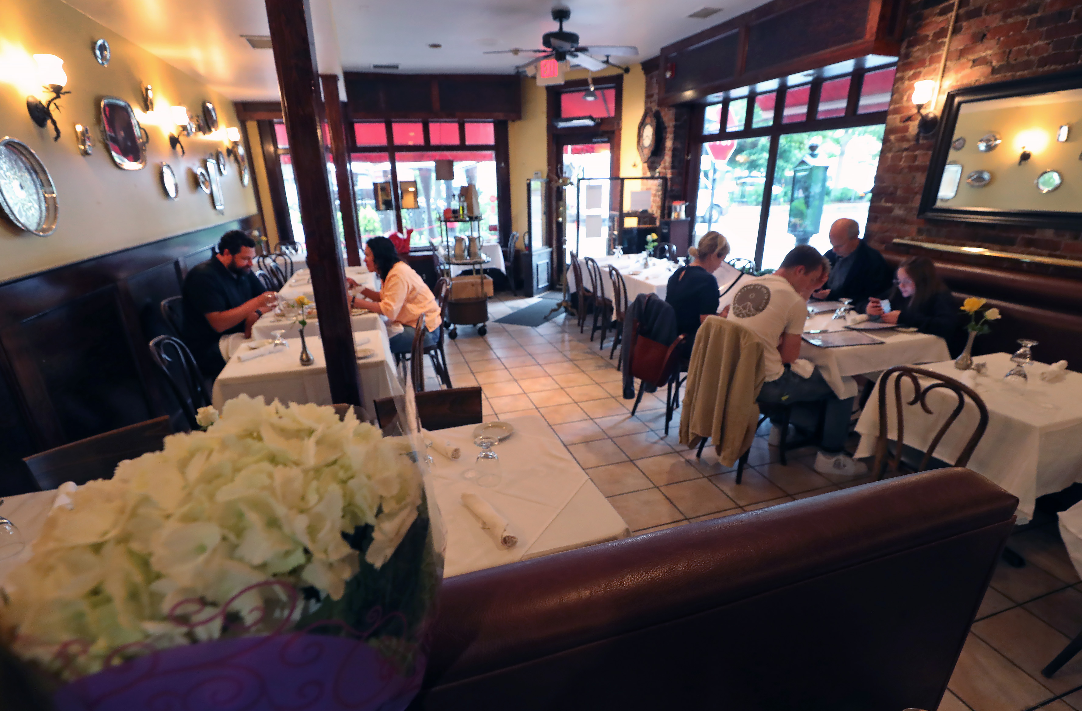 The scene inside on a rainy night at Ma Maison in Boston.