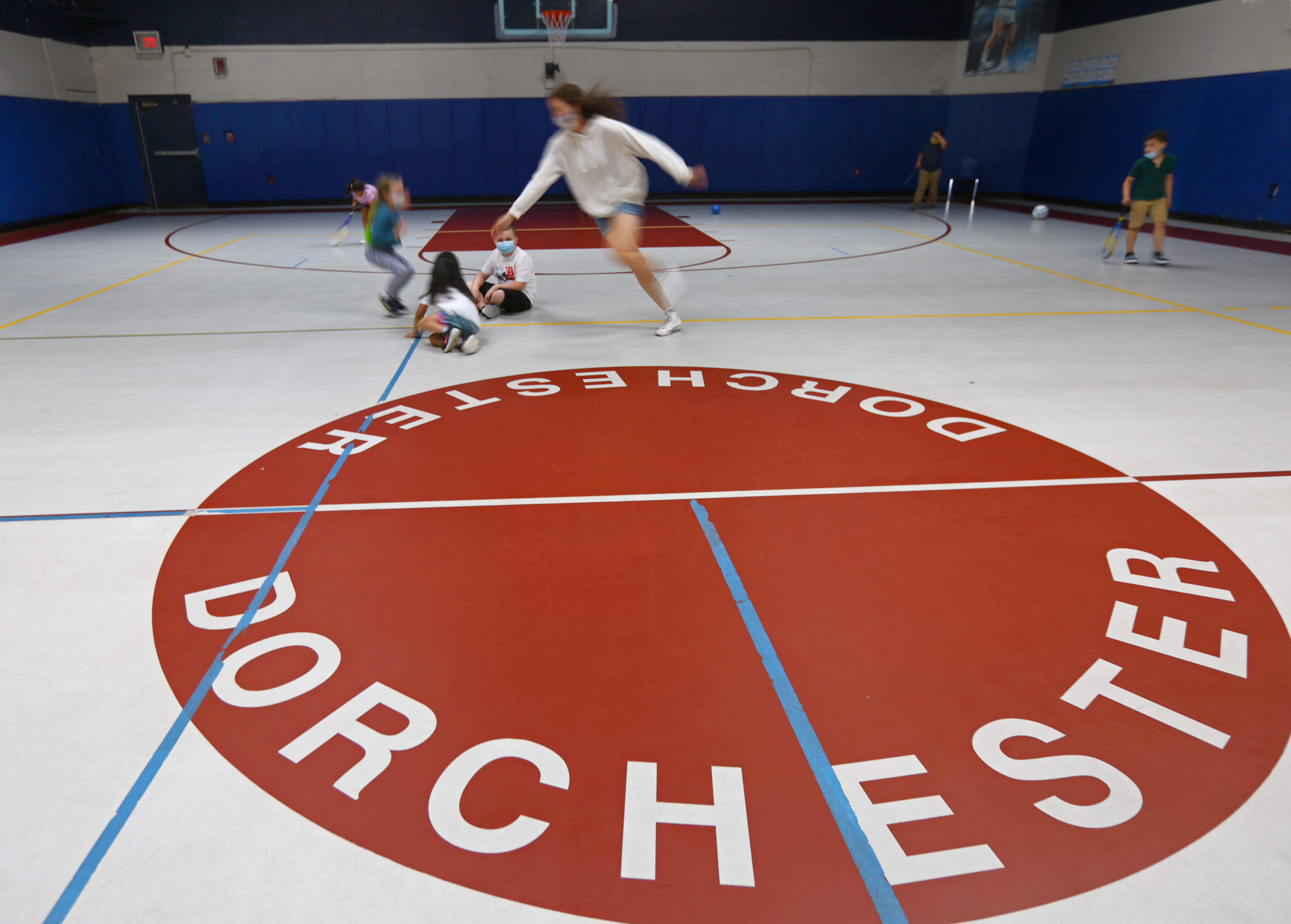 Learning Hub assistant Sarah McCarthy played Duck, Duck, Goose with kids at the Marr Clubhouse of the Boys & Girls Clubs of Dorchester.