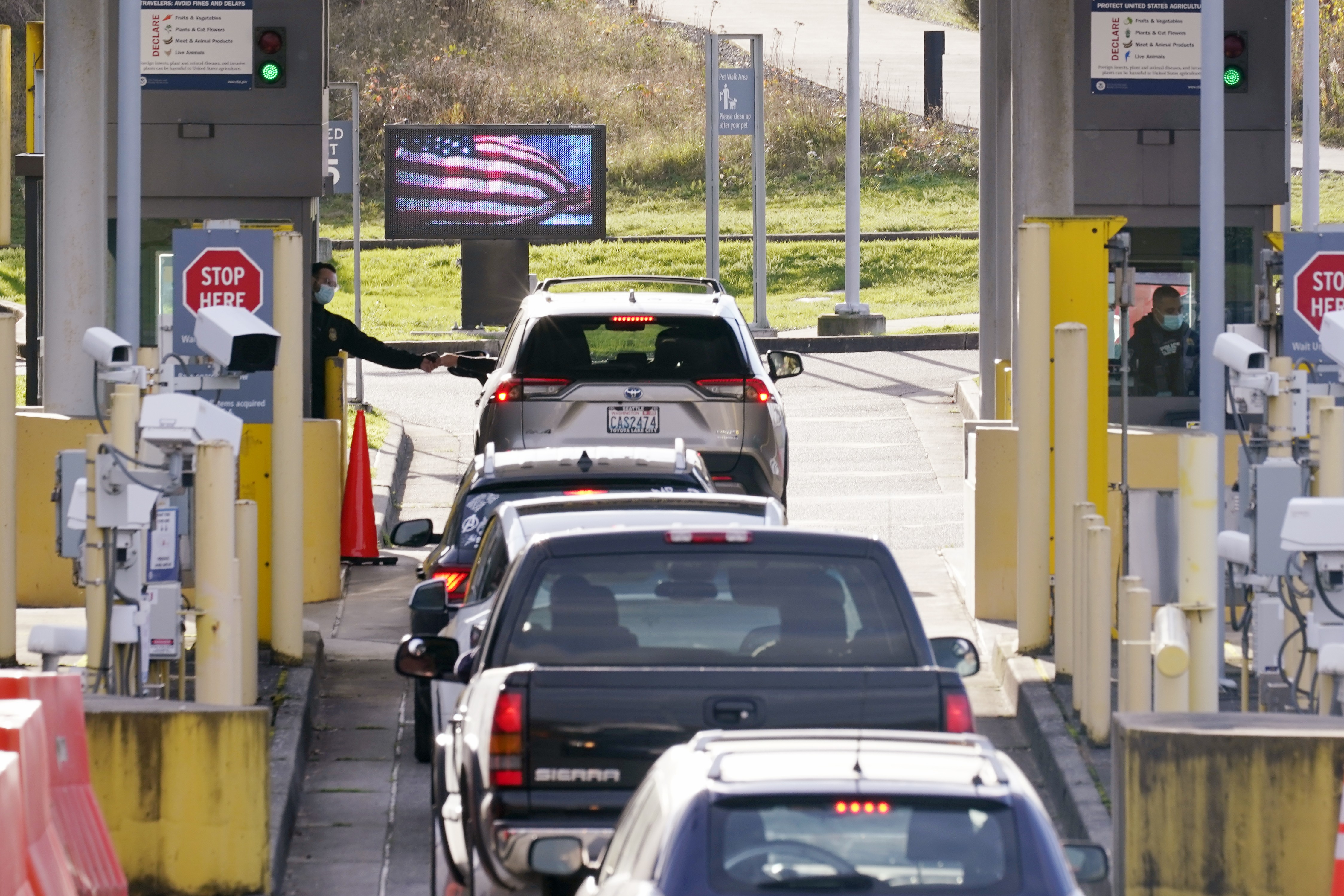 Cars lined up to enter the US from Canada at the Peace Arch border crossing Nov. 8 in Blaine, Wash.