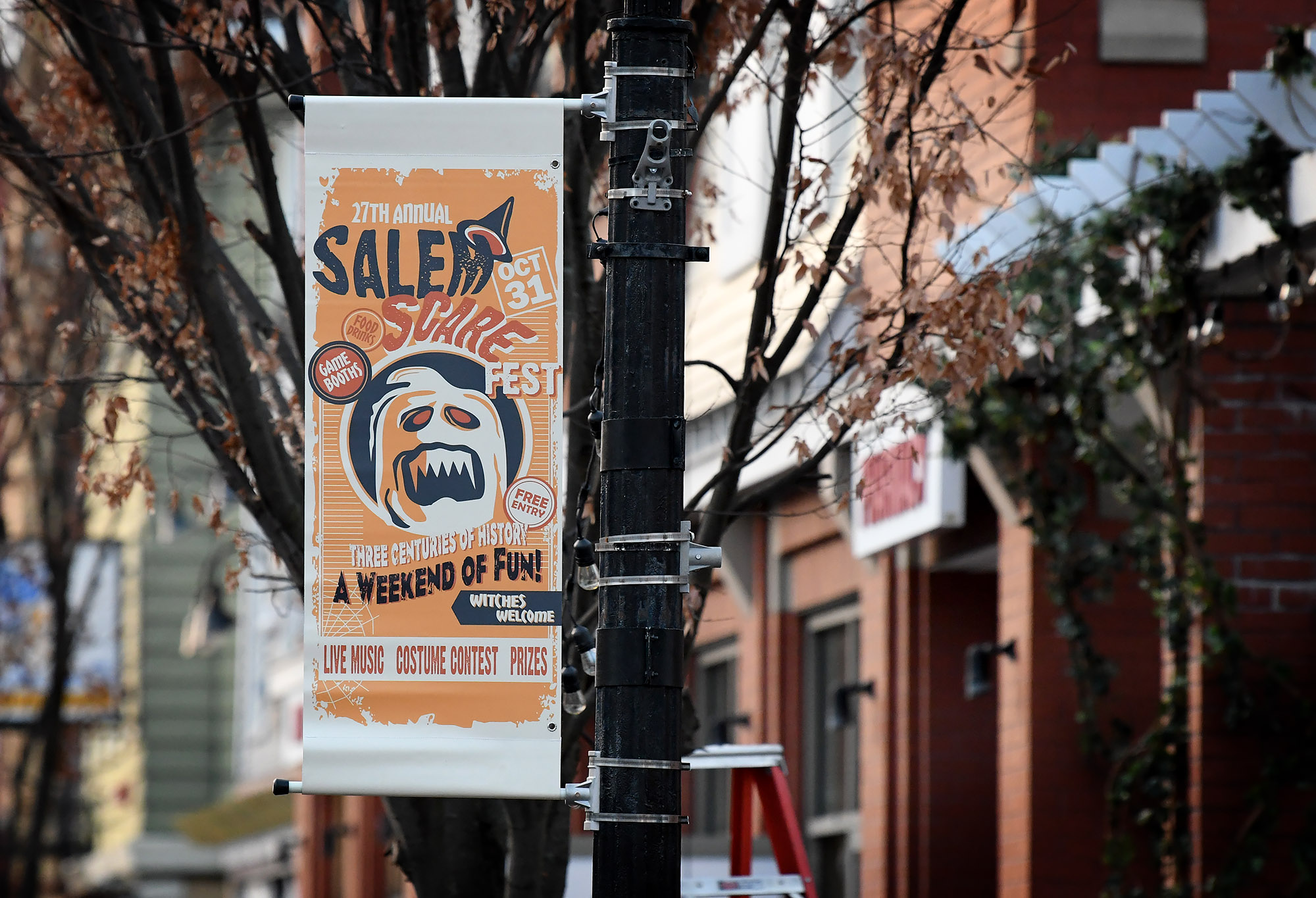 A banner highlighting a fictional Halloween event hung from poles along Atwell Avenue.