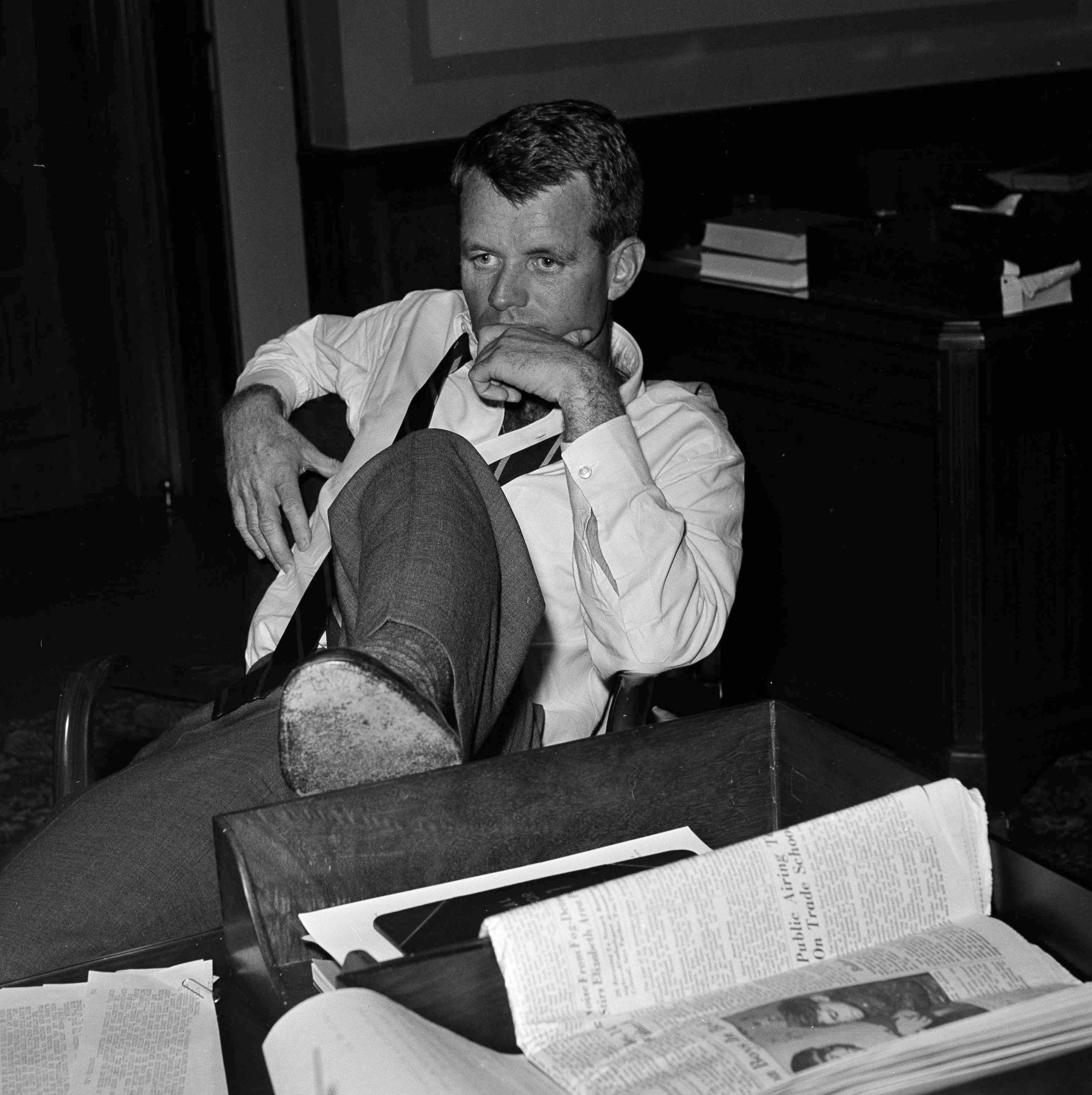 Robert F. Kennedy, U.S. Attorney General and brother of President John F. Kennedy, is shown in deep thought at the Justice Department as he worked with aides considering legal measures following racial violence in Montgomery, Ala., May 21, 1961, Washington, D.C. The riot was touched off by a freedom ride arriving from Birmingham, Ala., May 20. He ordered a task force of U.S. Marshals and Byron R. White, Deputy U.S. Attorney General, to the area to safeguard federal rights. (AP Photo/Byron Rollins)