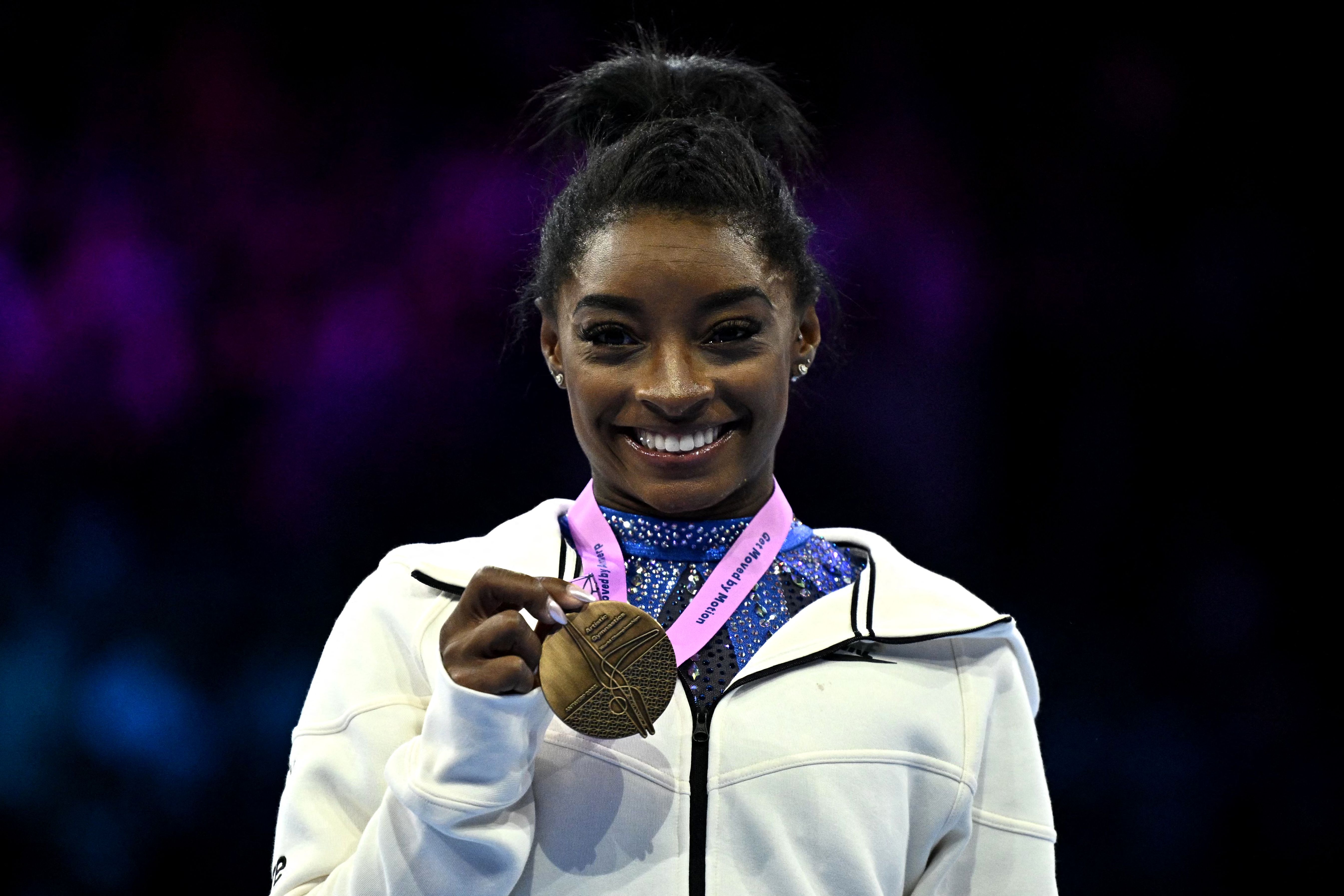 Simone Biles wins sixth all-around title at worlds to become most decorated  gymnast in history - The Boston Globe