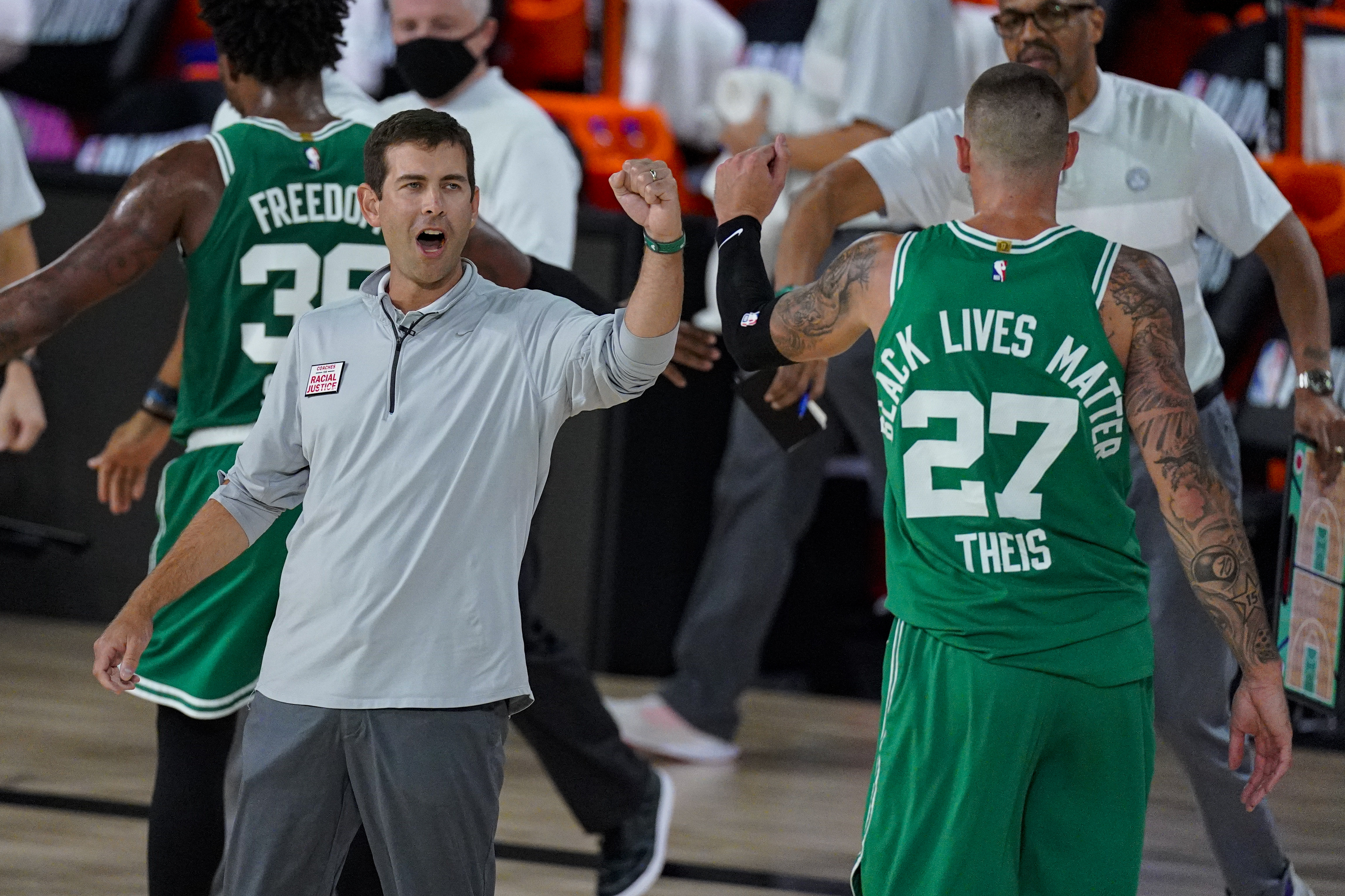 Daniel Theis celebrates with Brad Stevens during the second half of Wednesday's Game 6.