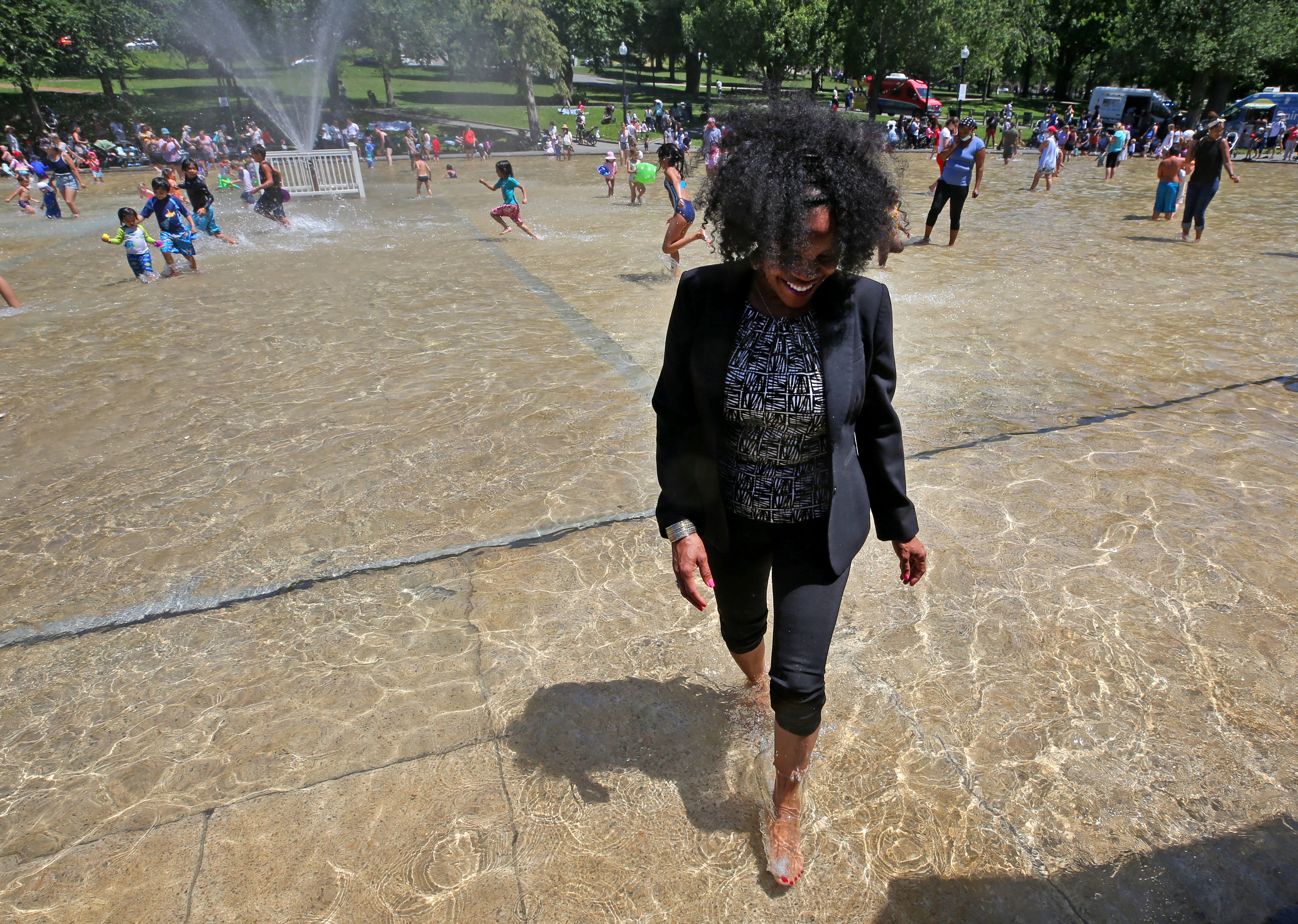 Acting Mayor Kim Janey went into the frog pond to celebrate its reopening Thursday afternoon.