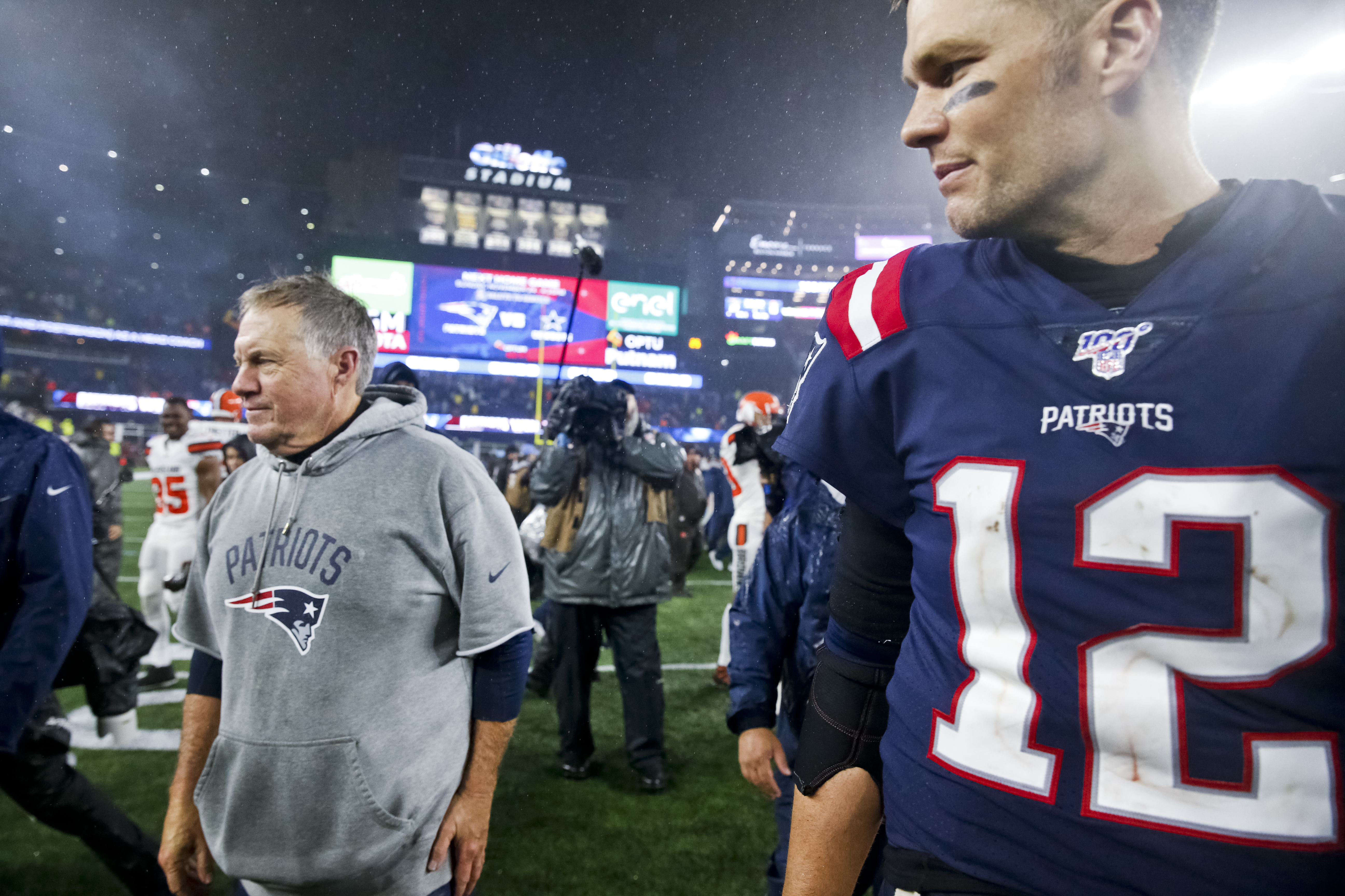 Bill Belichick and Tom Brady walk off the field after a win over the Browns last season.