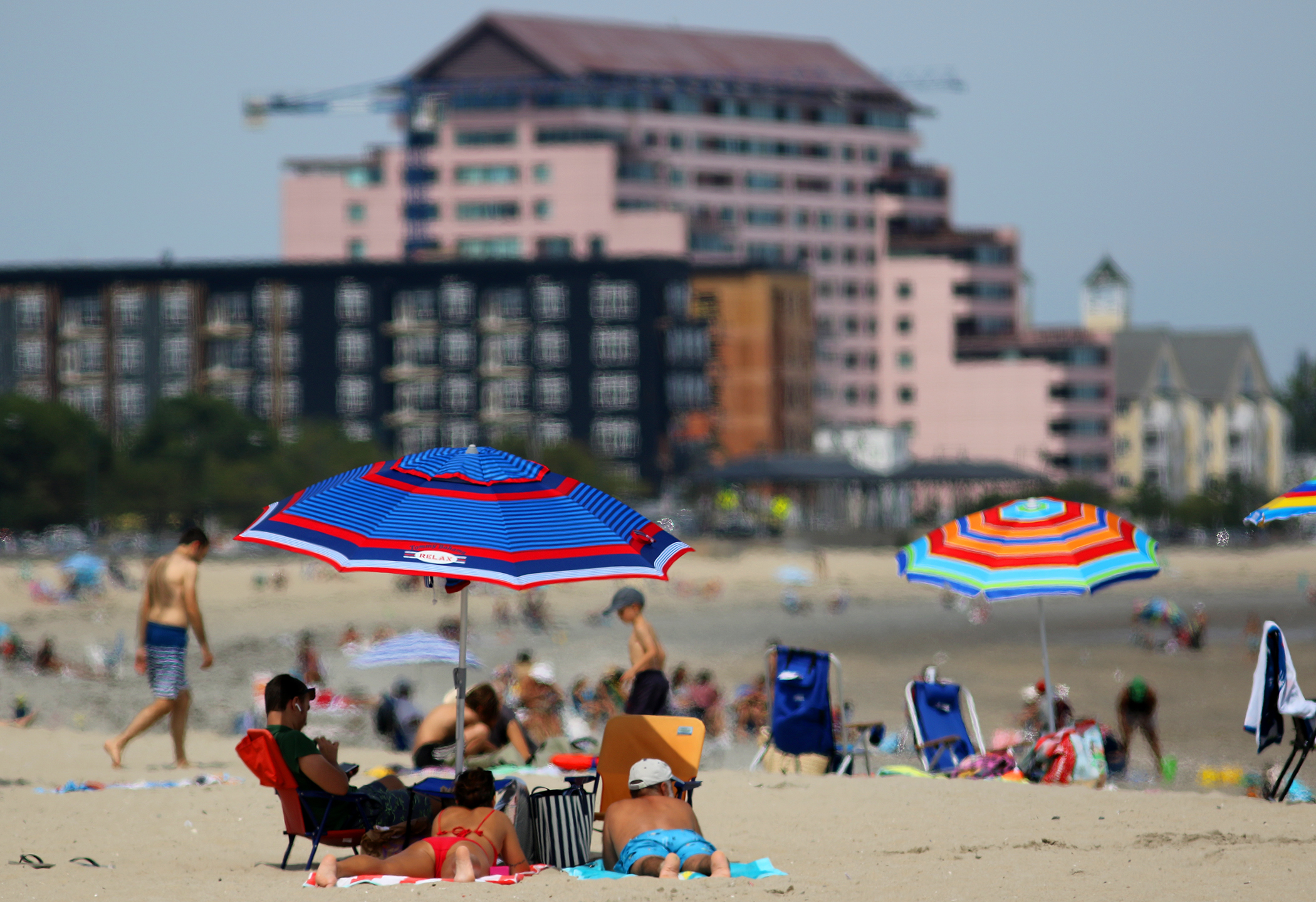 New homes under construction at 320 Revere Beach Boulevard form the backdrop for a sunny day at Crescent Beach.