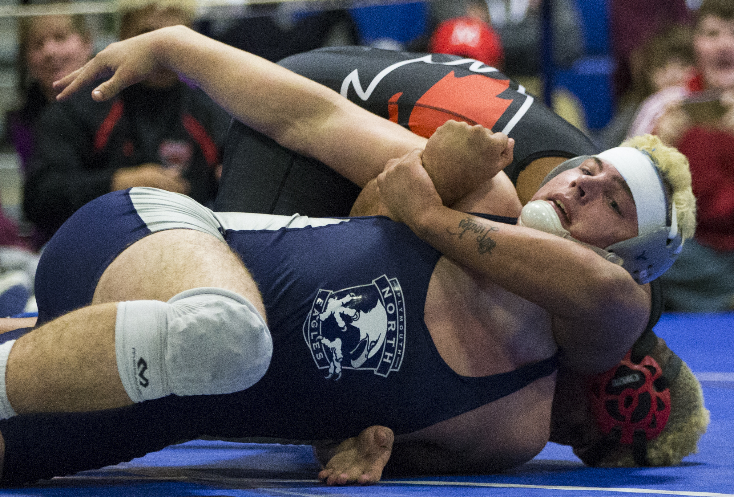 There's no room for social distancing in a wrestling match like the one seen here in February's All-State Tournament. It was the last MIAA wrestling event held before the pandemic.