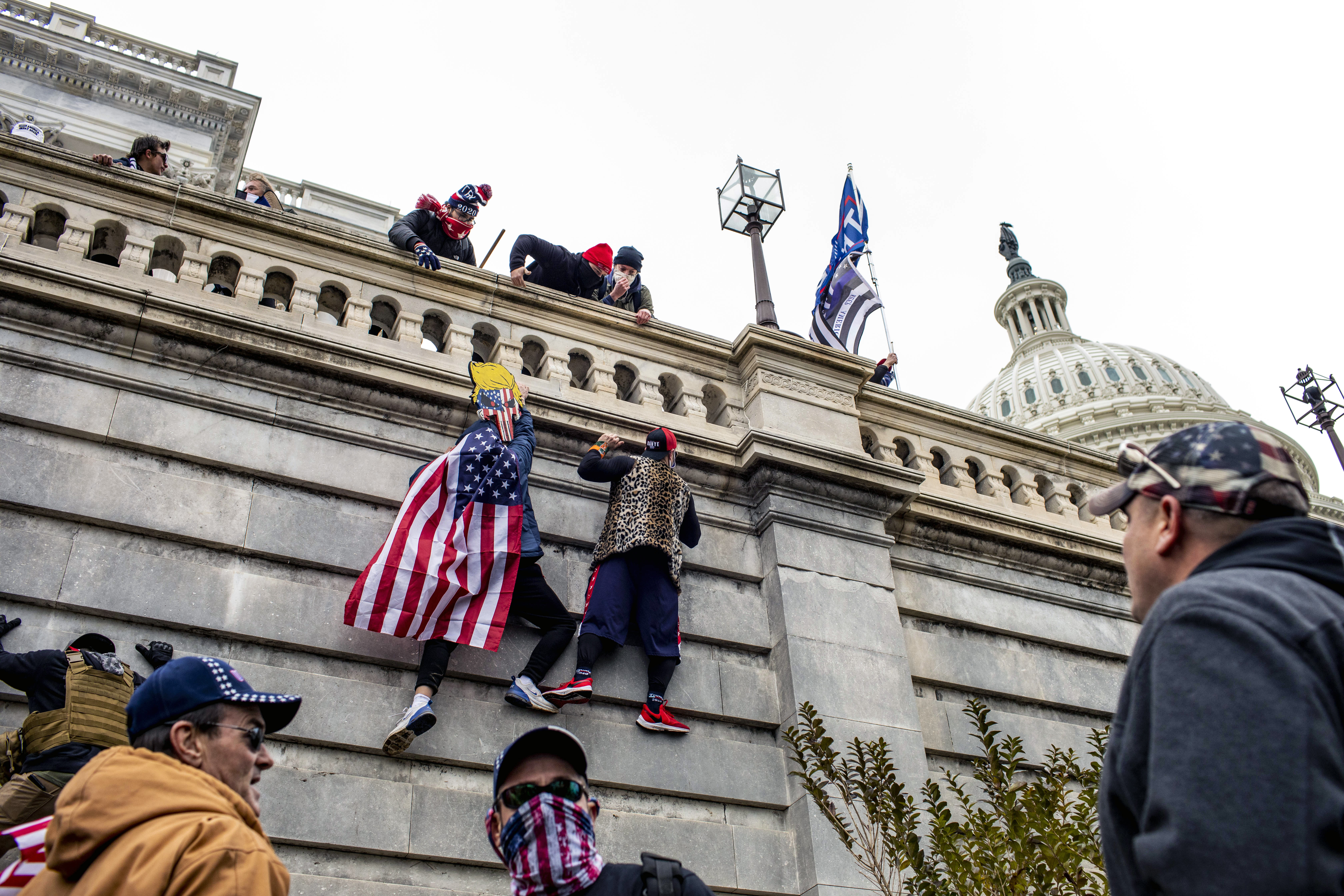 Protesters scaled the wall of the US Capitol in Washington after then-President Trump spoke at a rally on Jan. 6, 2021.