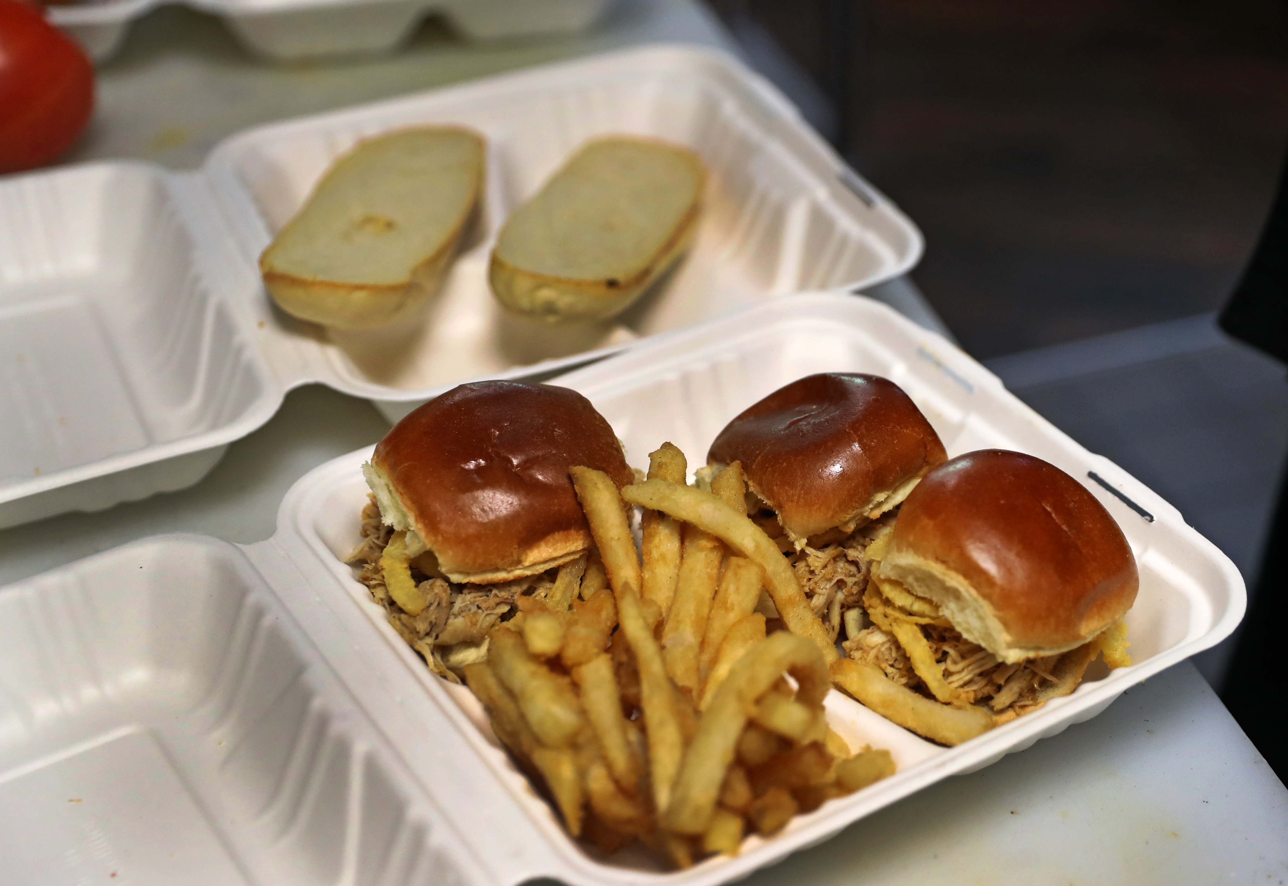 A chicken sandwich to go at 50Kitchen.