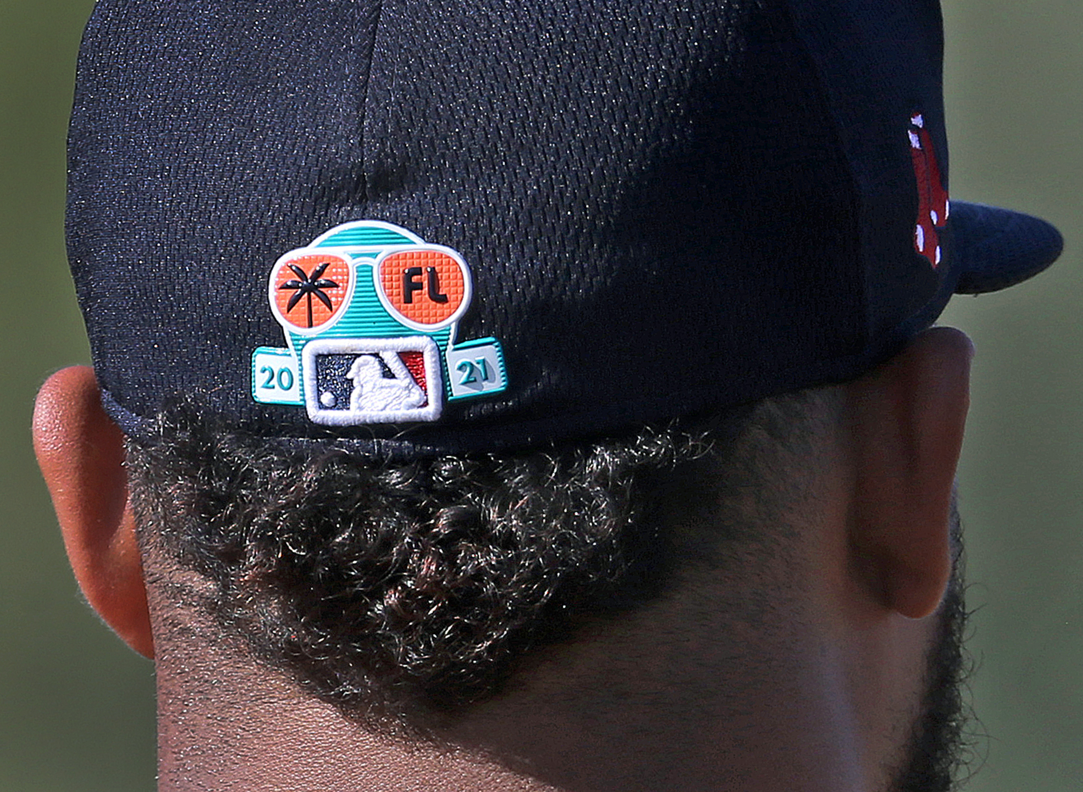 This year's spring training logo is seen on the hat of pitcher Darwinzon Hernández.