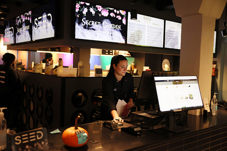 Workers prepare to open the SEED marijuana store for the day on Nov. 4 in Boston.