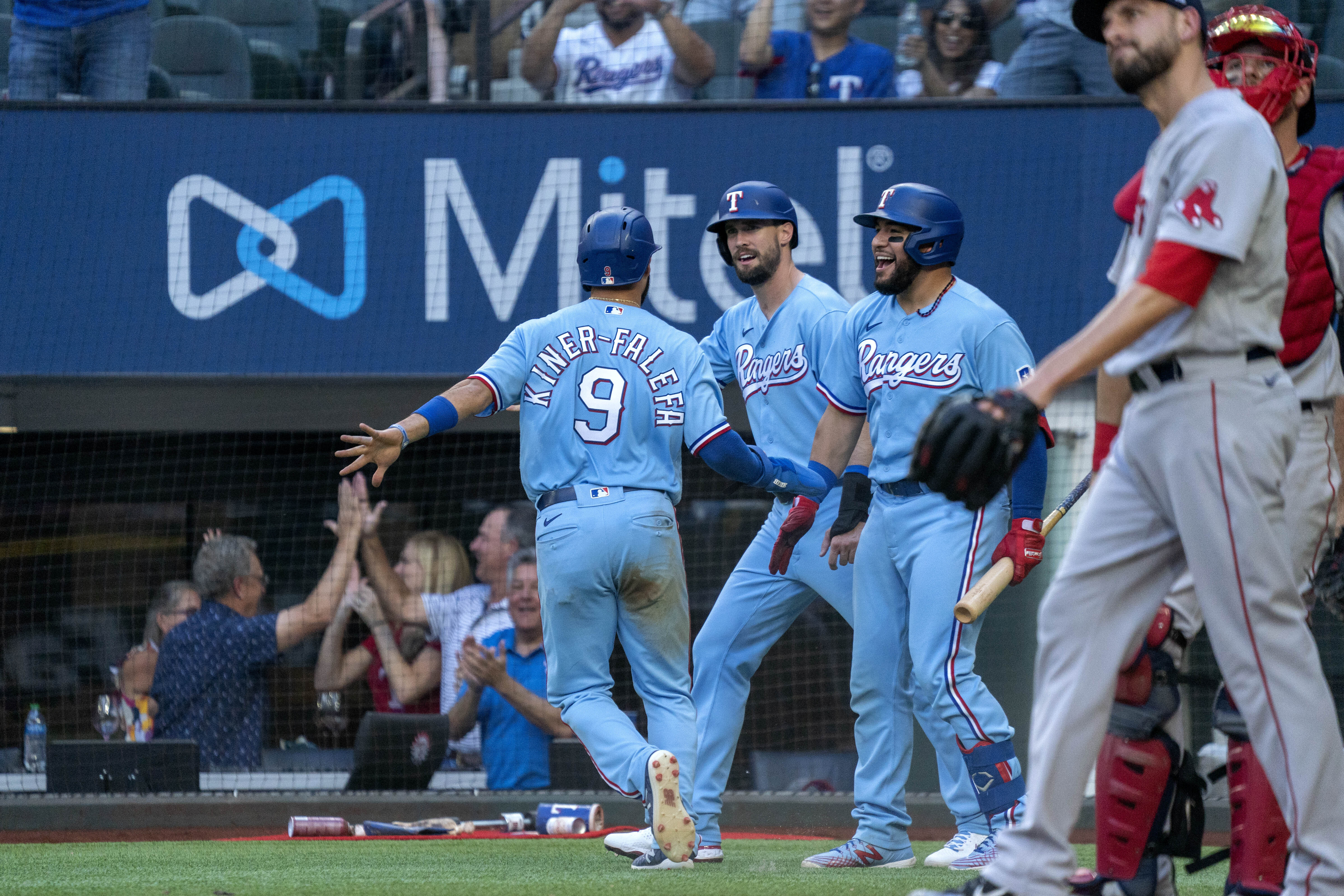 Red Sox closer Matt Barnes (right) and catcher Kevin Plawecki react after Isiah Kiner-Falefa (9) scored on Brock Holt's single in the eighth inning.