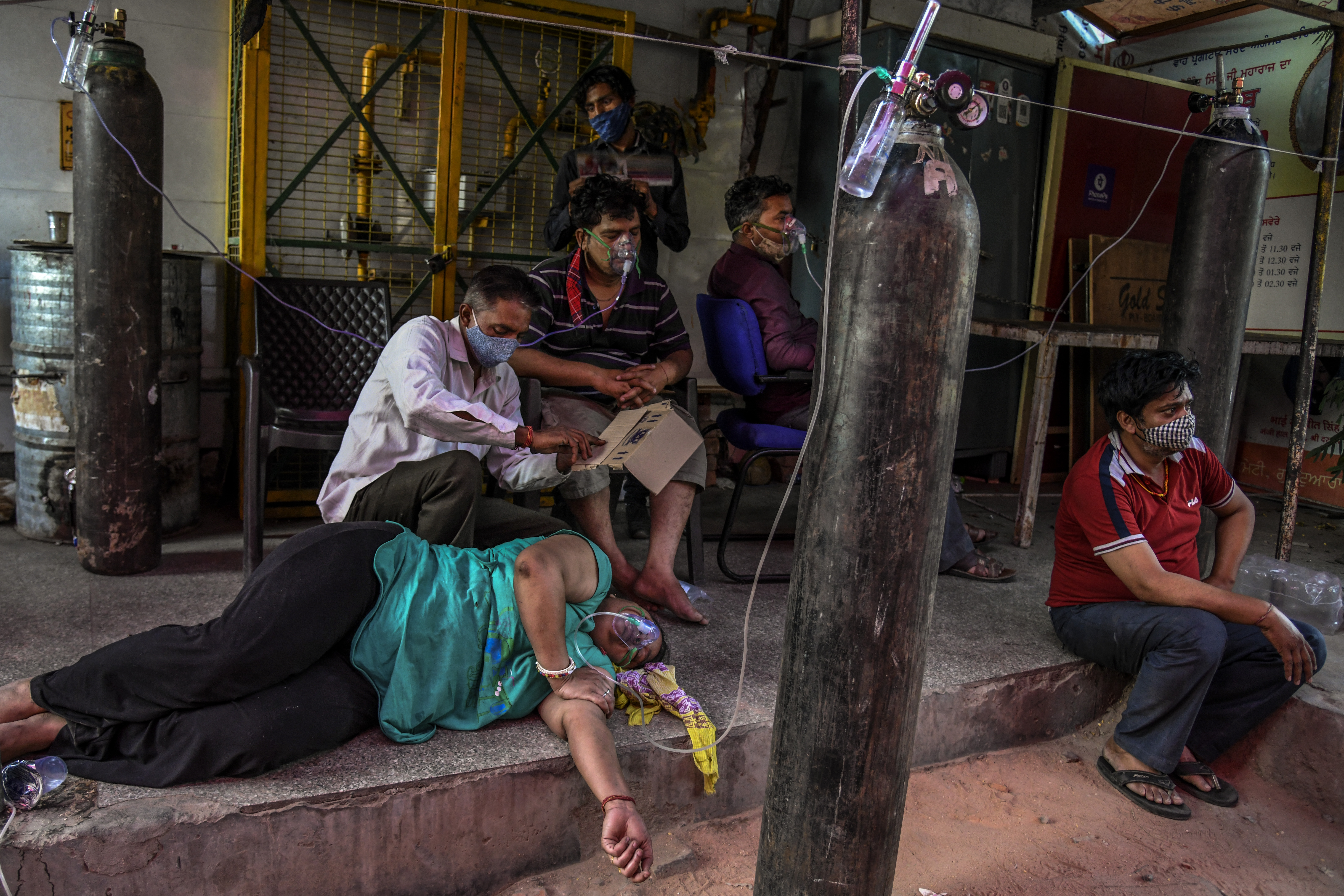 COVID-19 patients received oxygen in Delhi on Sunday.