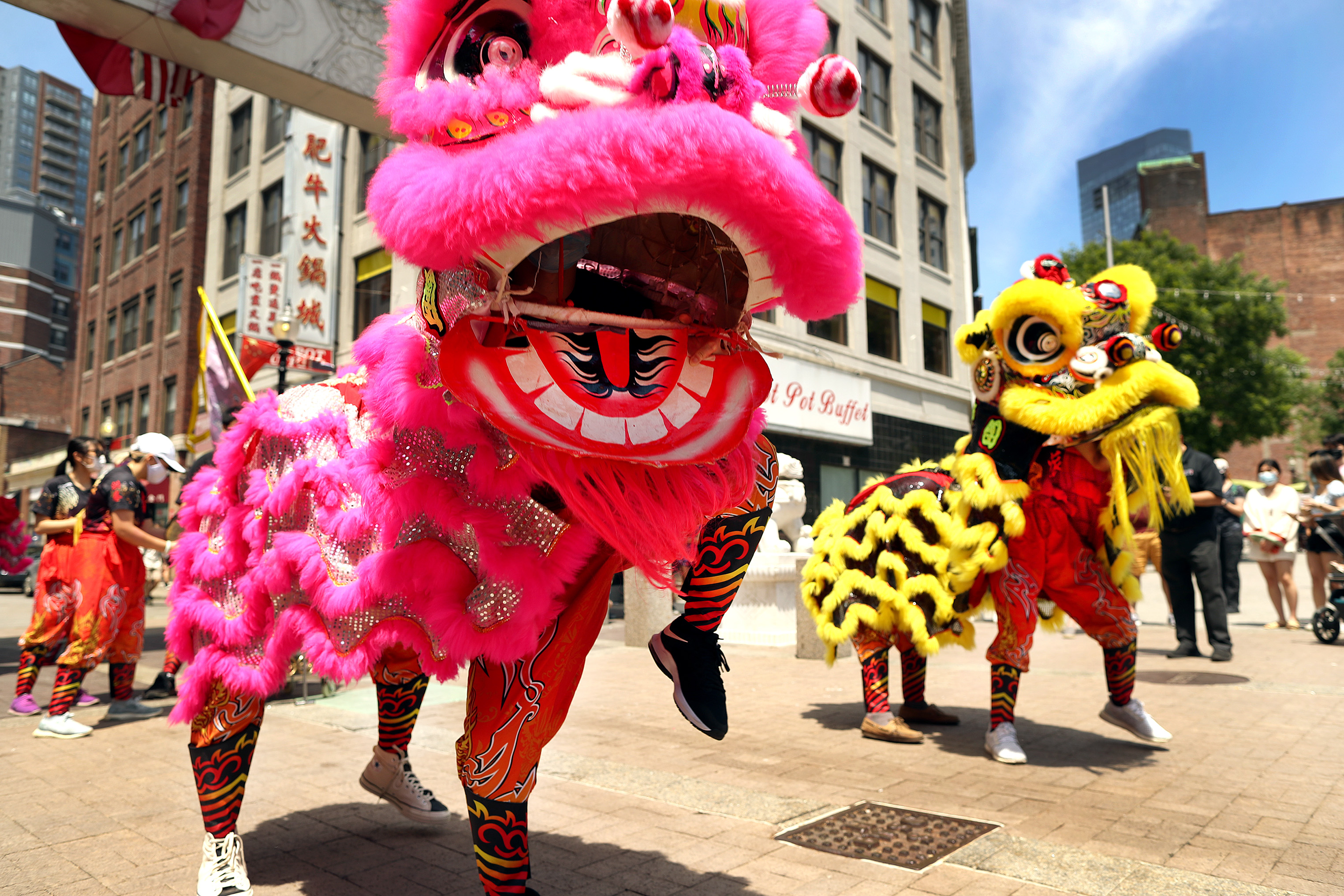 Lion dancers perform in Chinatown to chase away the coronavirus The