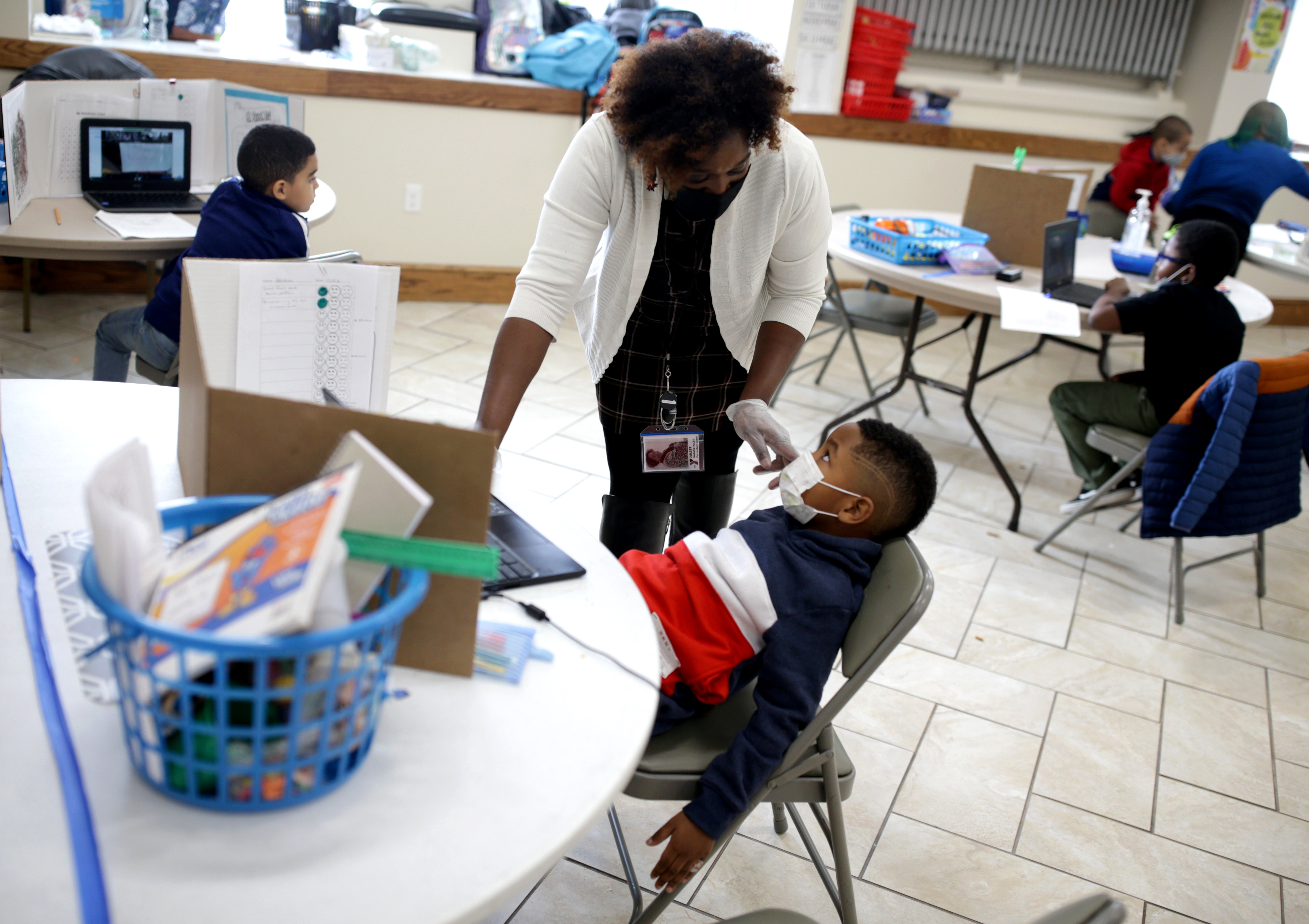 Education coordinator Juliet Hazard-Riley asked Jahdian Amaya if he wanted to take a break from his schoolwork.
