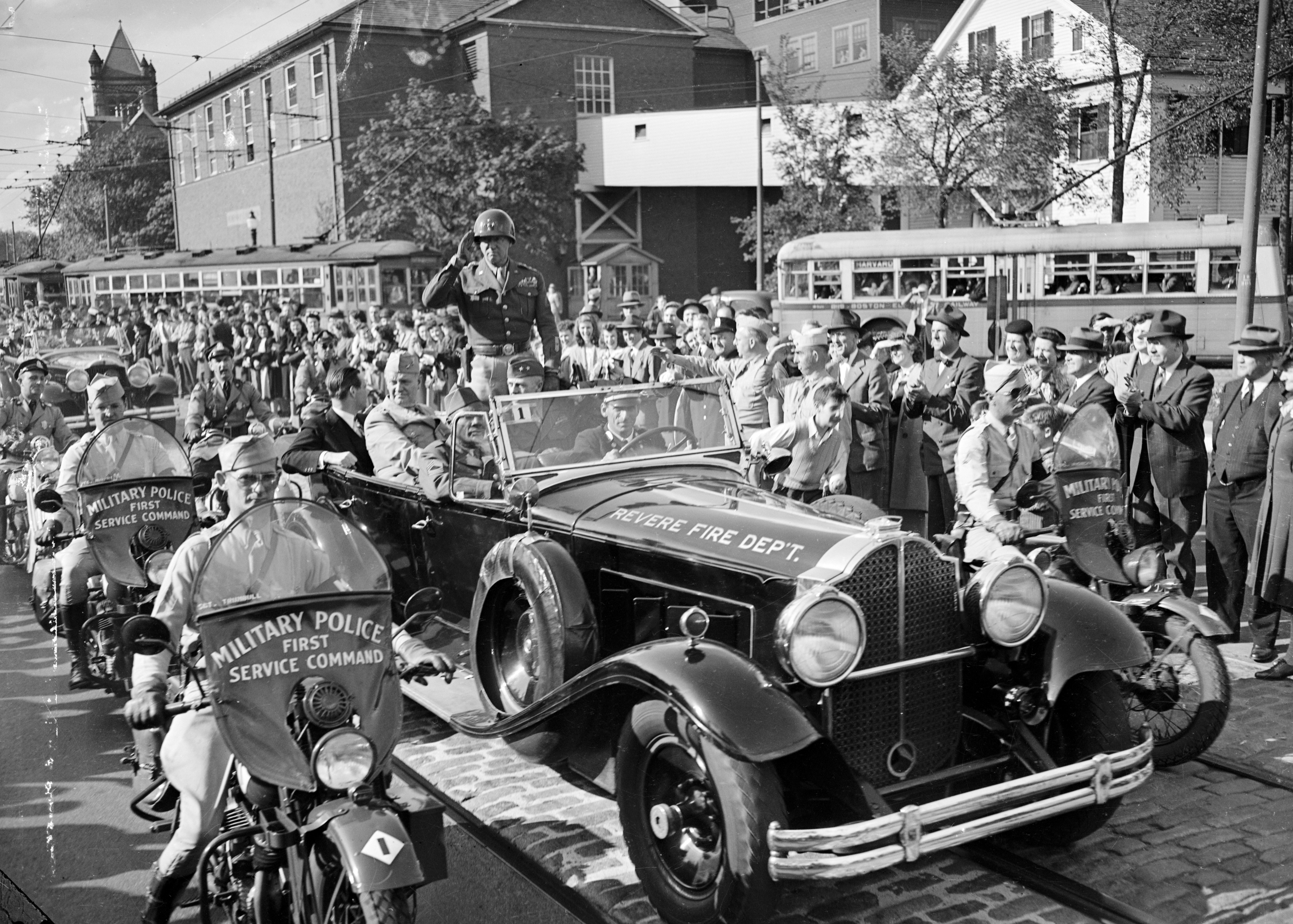General George S. Patton, Jr. acknowledged the cheers of the throngs that gathered along a parade route in Boston in 1945.