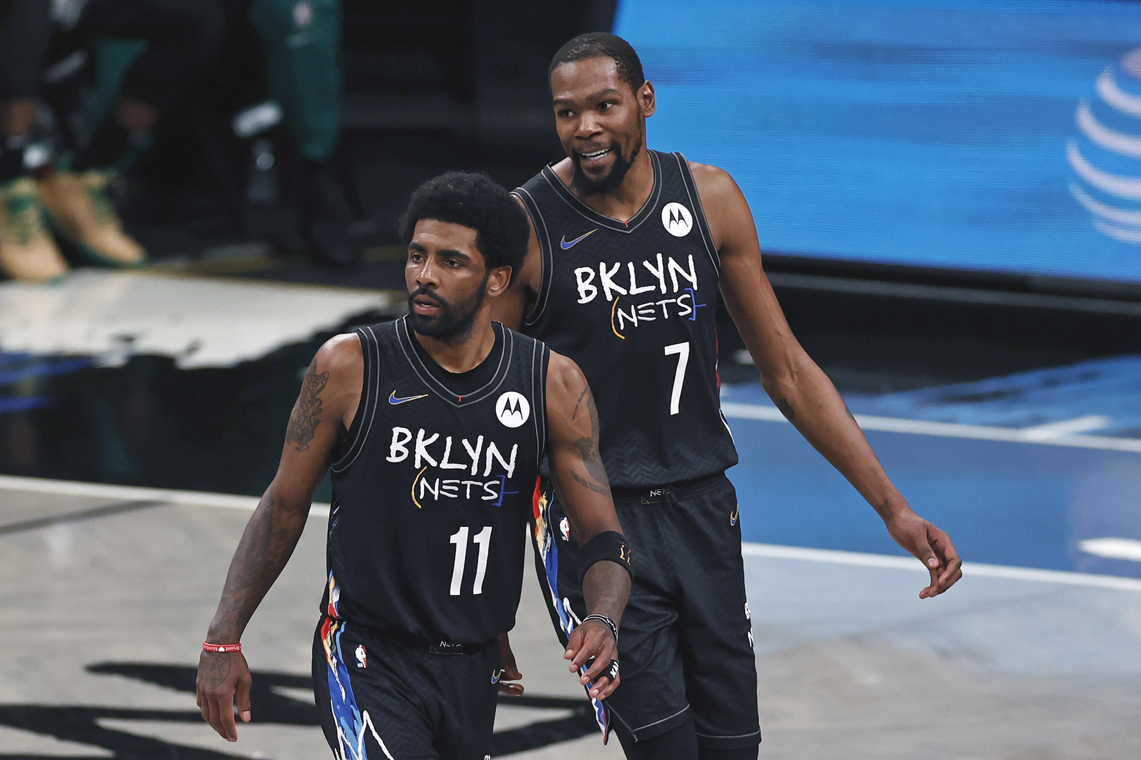 Brooklyn Nets guard Kyrie Irving, center left, and forward Kevin