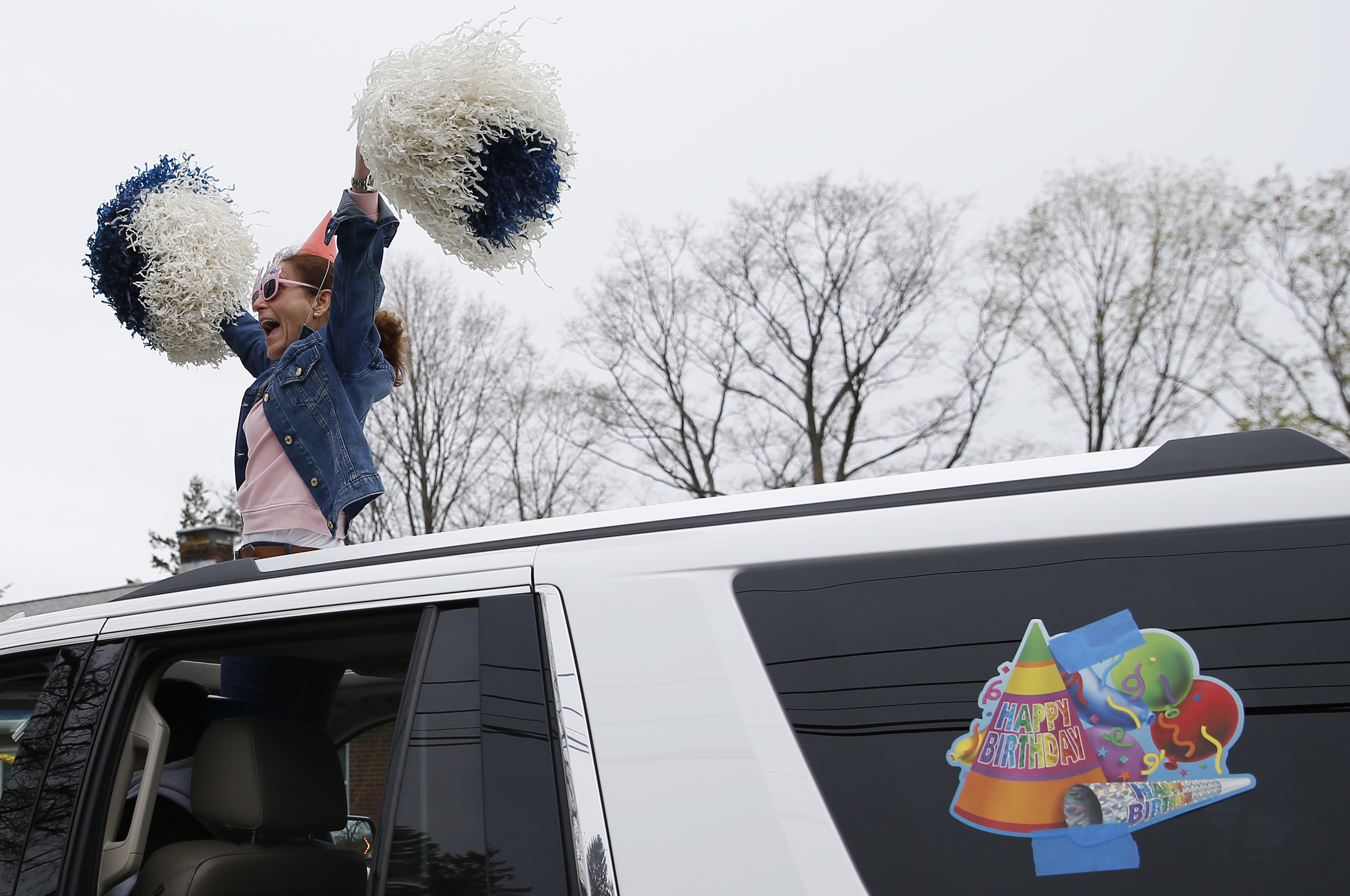 Medford, MA - 4/26/20 - Friends and family paraded by Paul Hollien (not pictured) to celebrate his 5th Birthday with a car parade in order to properly socially distance themselves to help prevent the spread of coronavirus or COVID-19. (Jessica Rinaldi/Globe Staff)