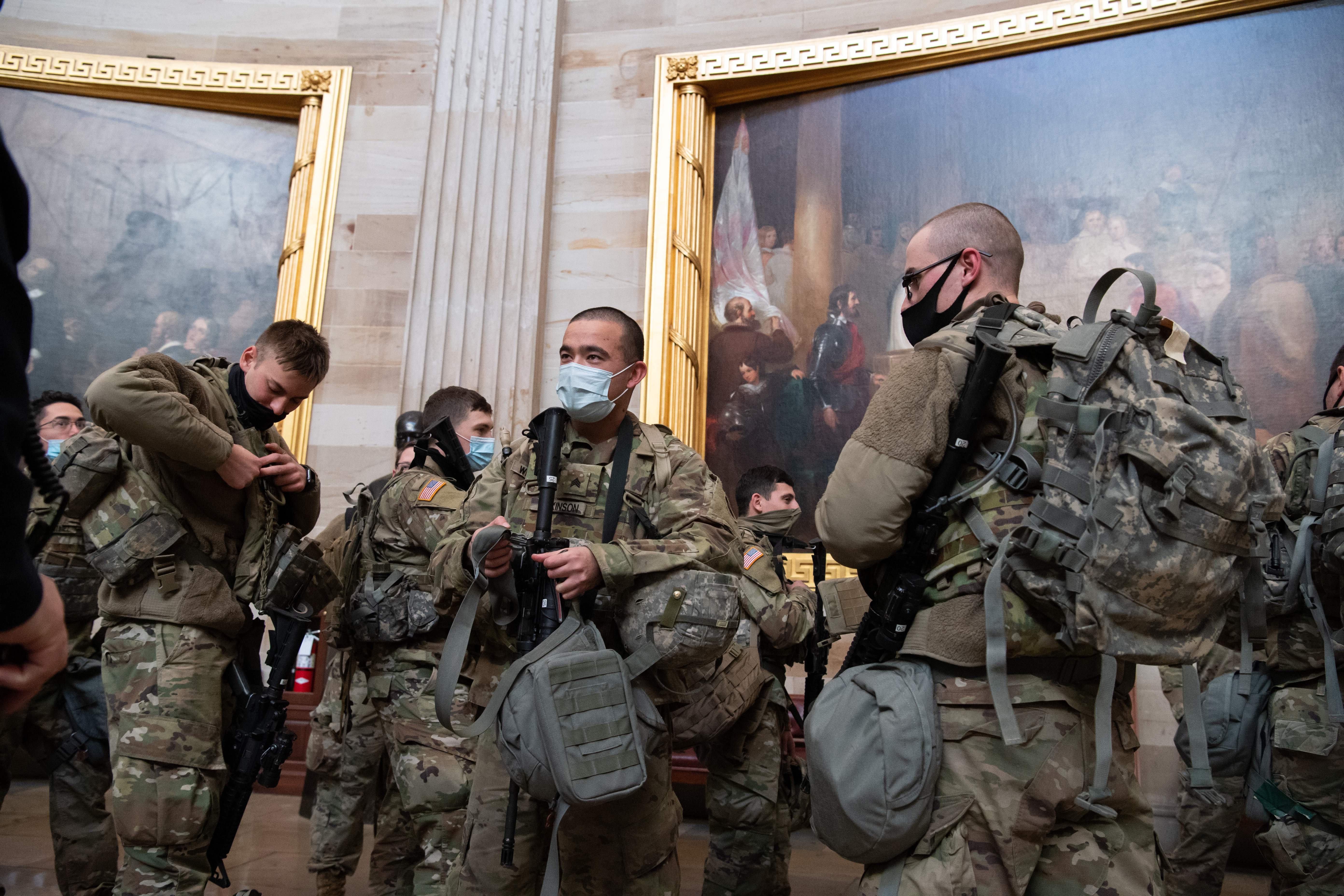 Members of the National Guard walked through the Rotunda of the US Capitol.